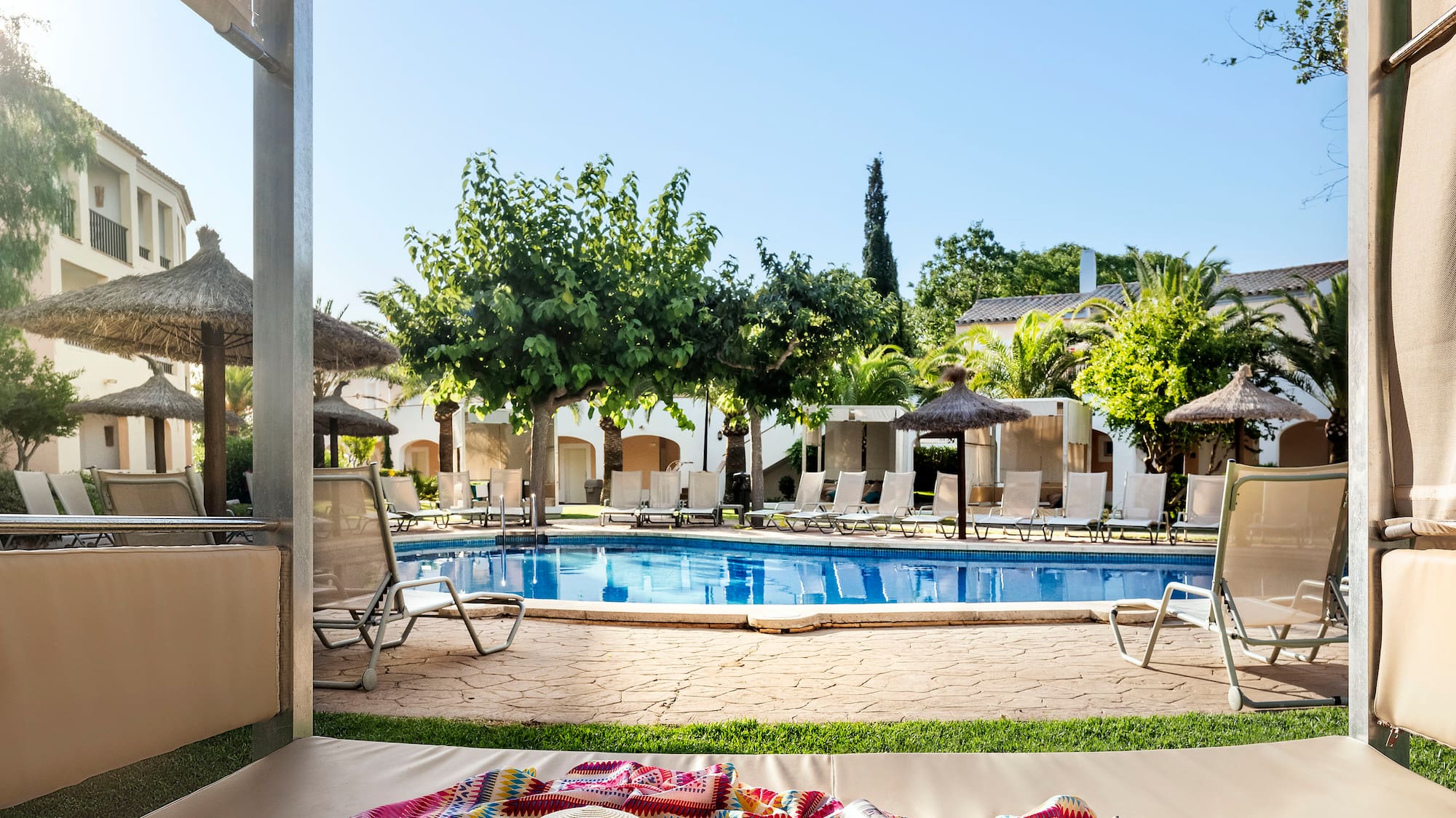 a pool with a blanket and hat on it