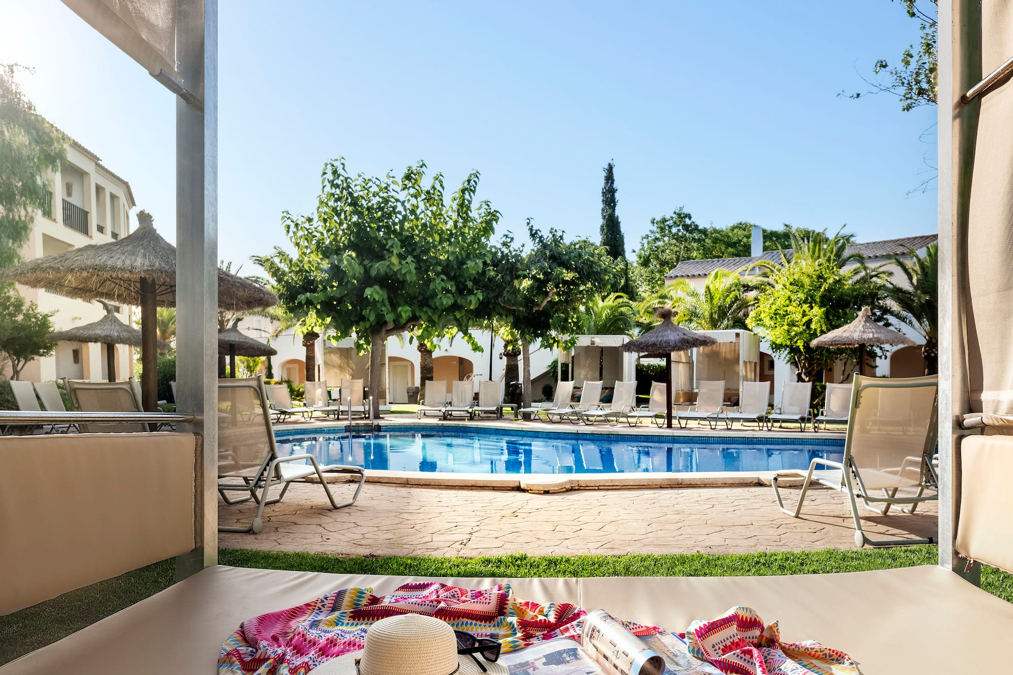 a pool with a blanket and hat on it