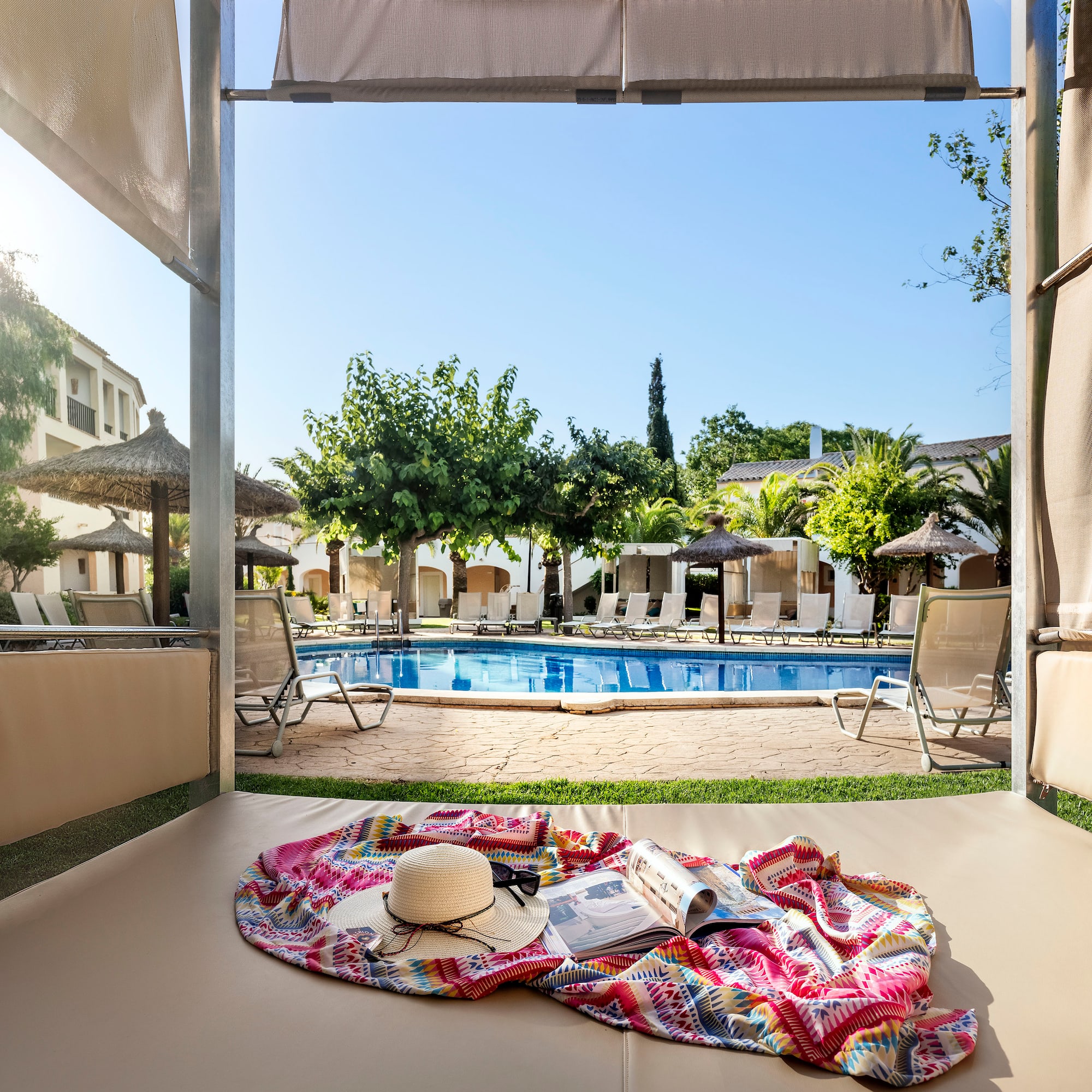 a pool with a blanket and hat on it