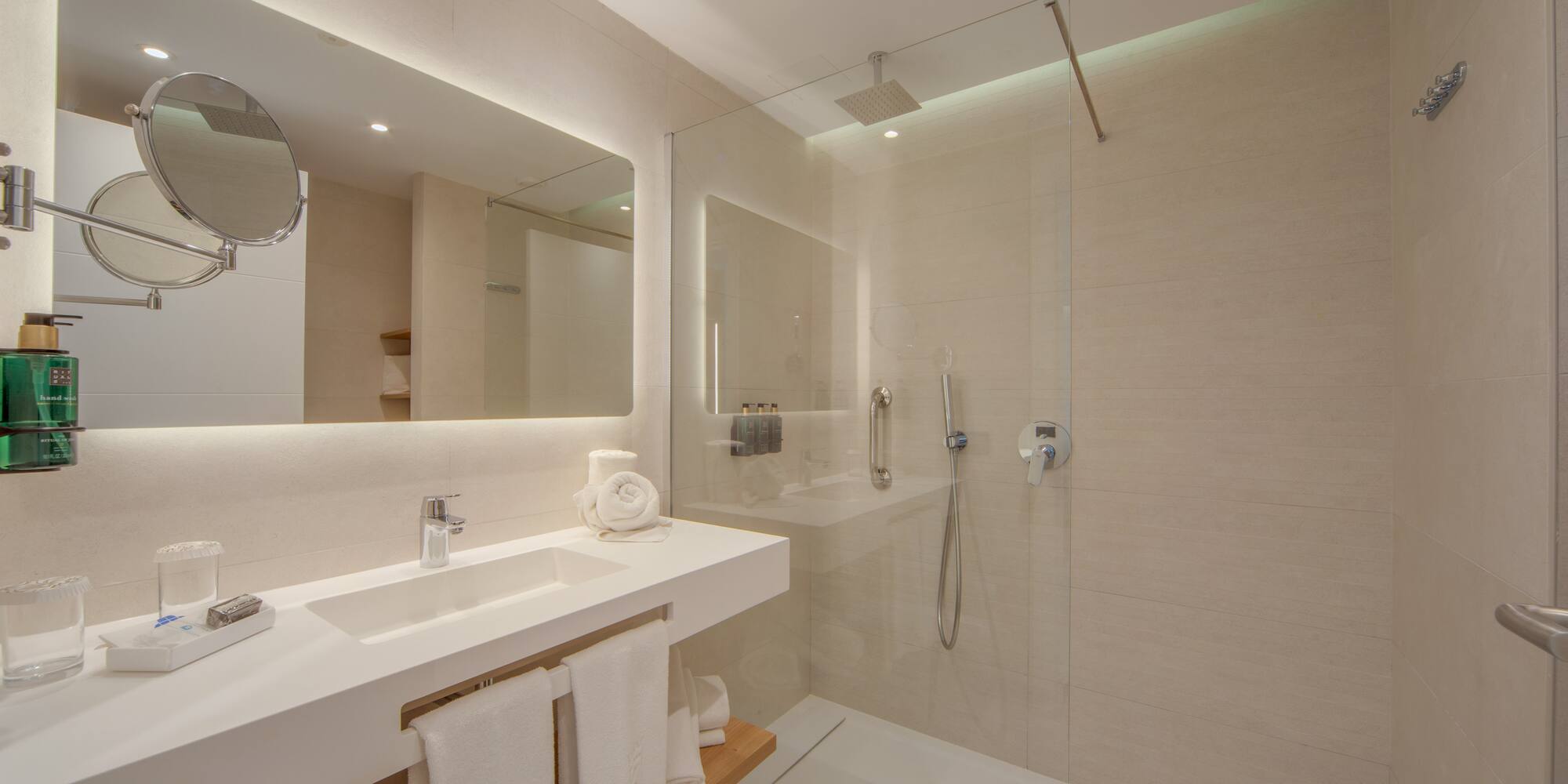 a bathroom with a shower and sink