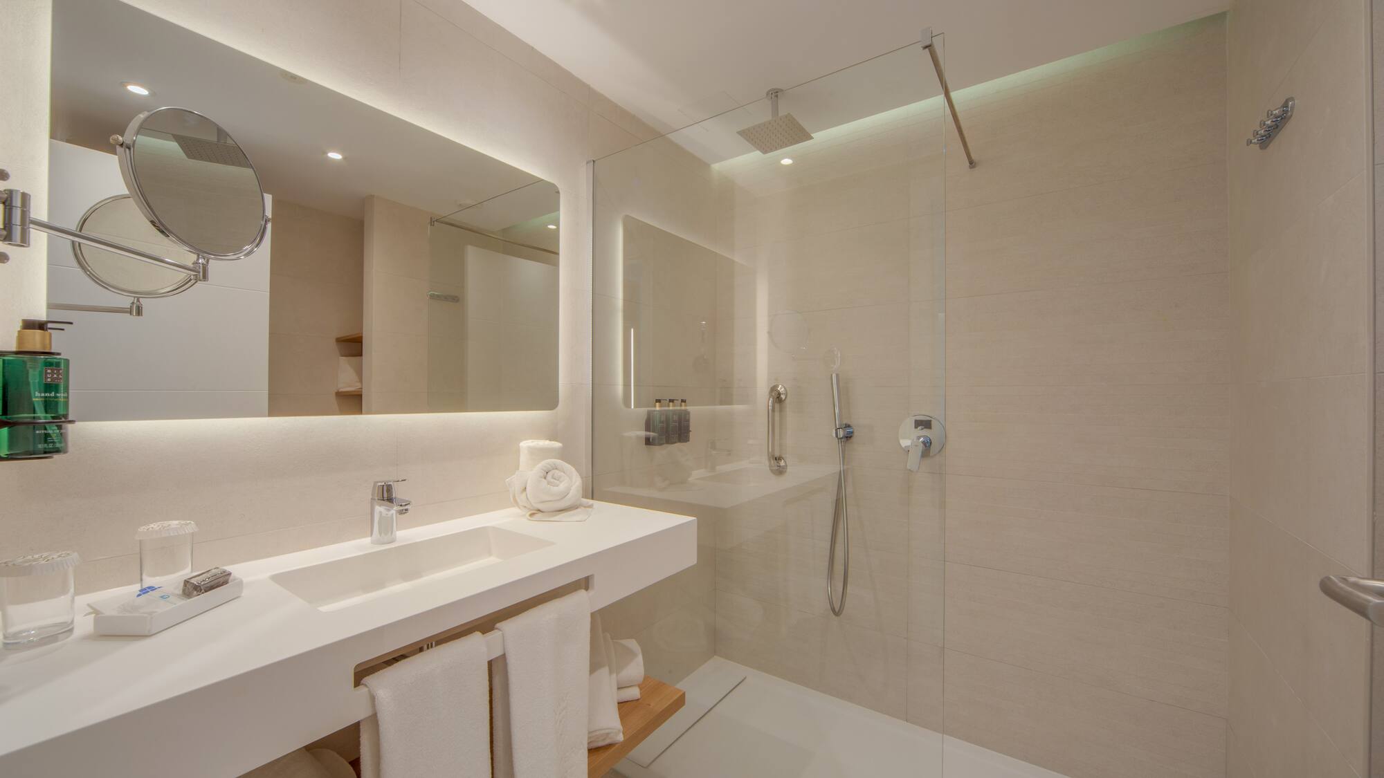 a bathroom with a shower and sink