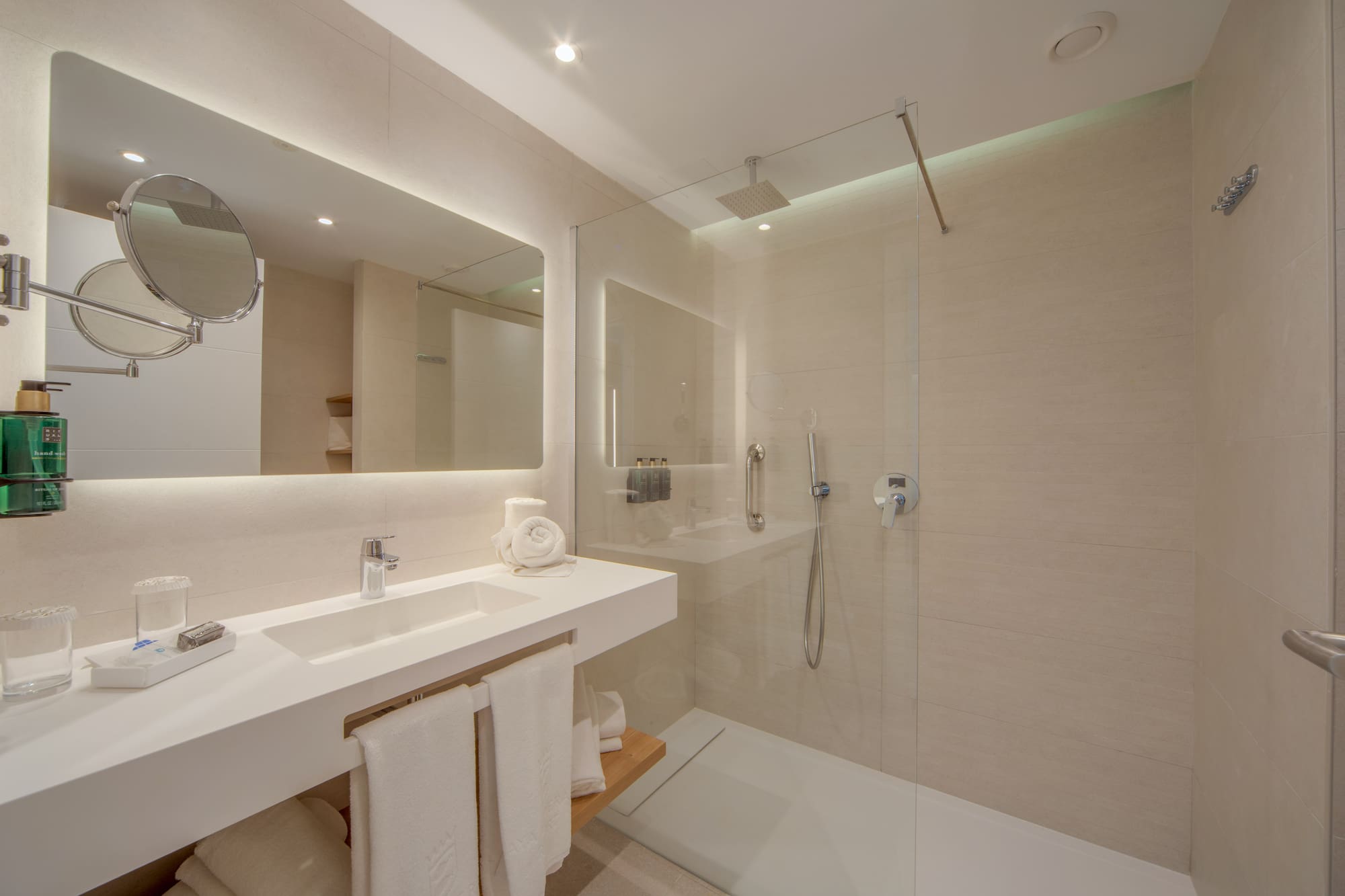 a bathroom with a shower and sink