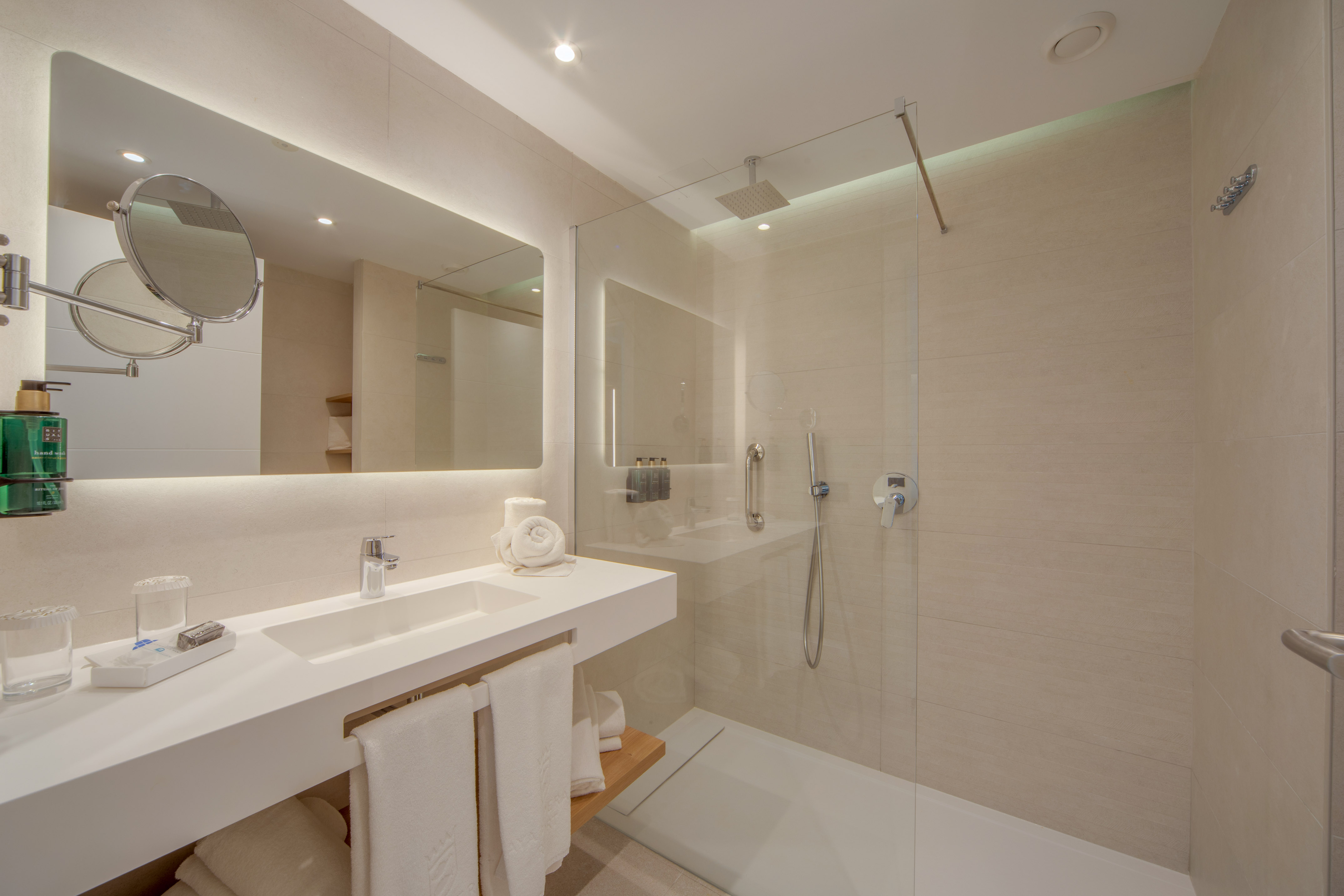 a bathroom with a shower and sink