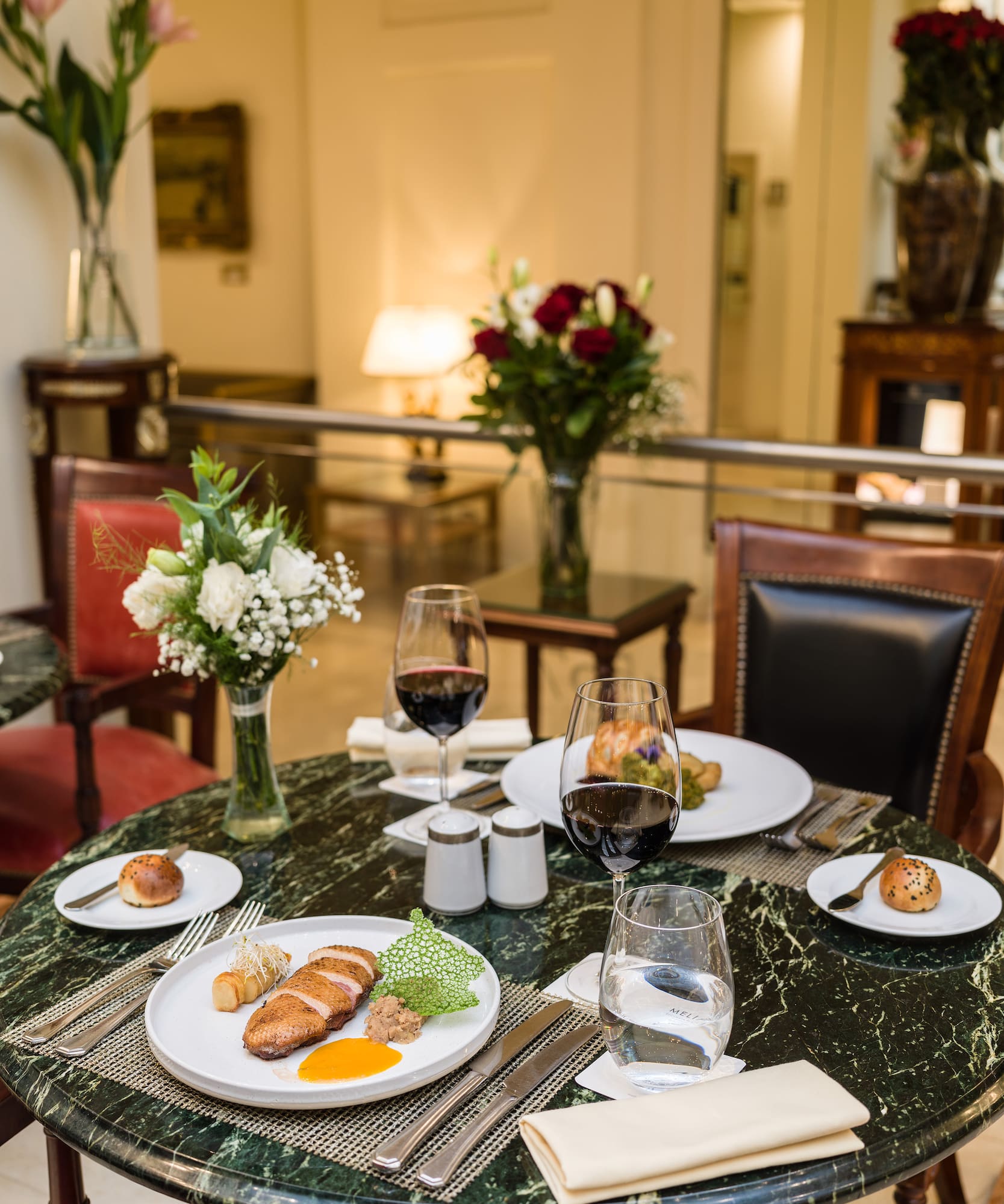 a table with food and wine glasses
