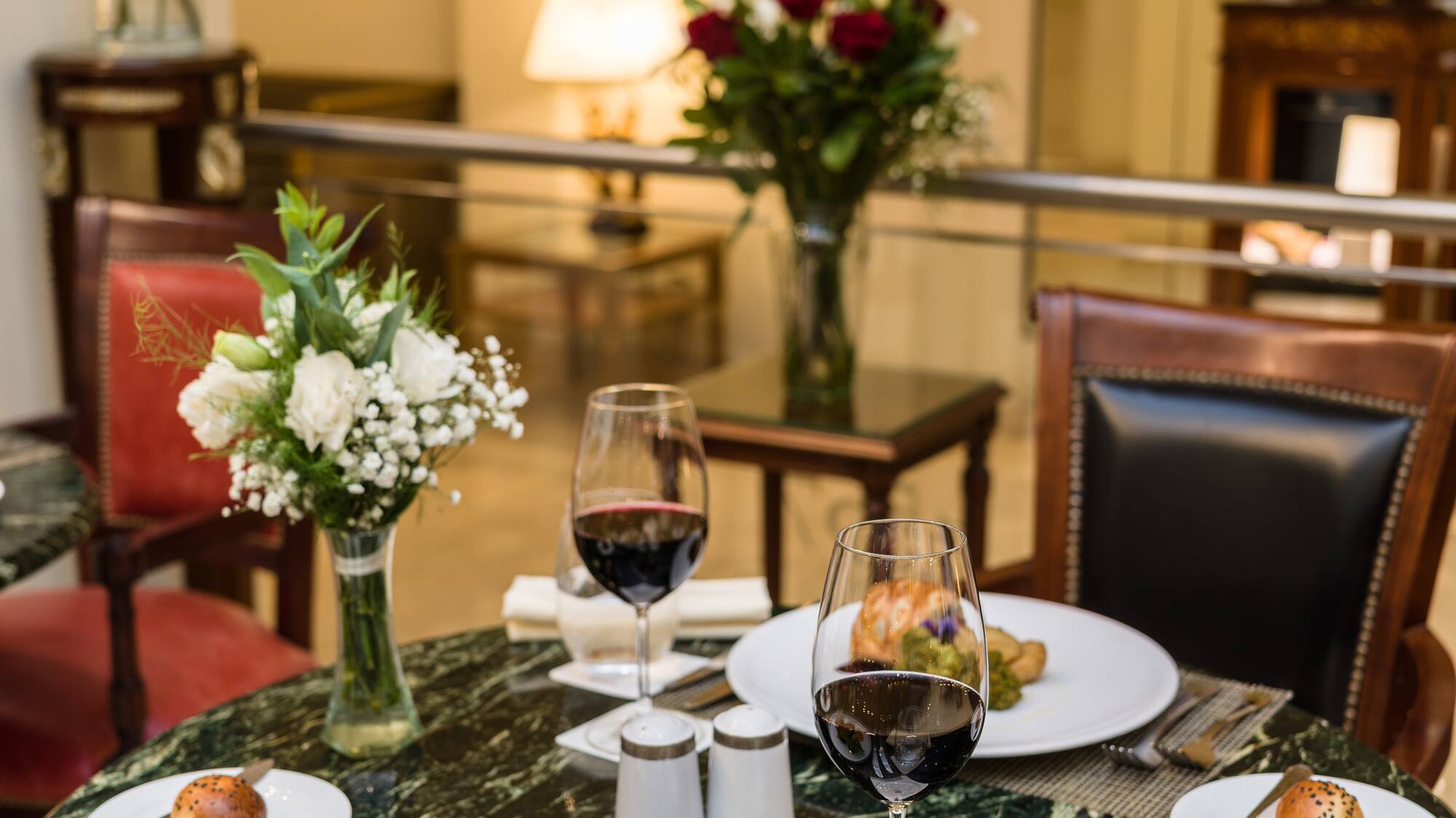 a table with food and wine glasses