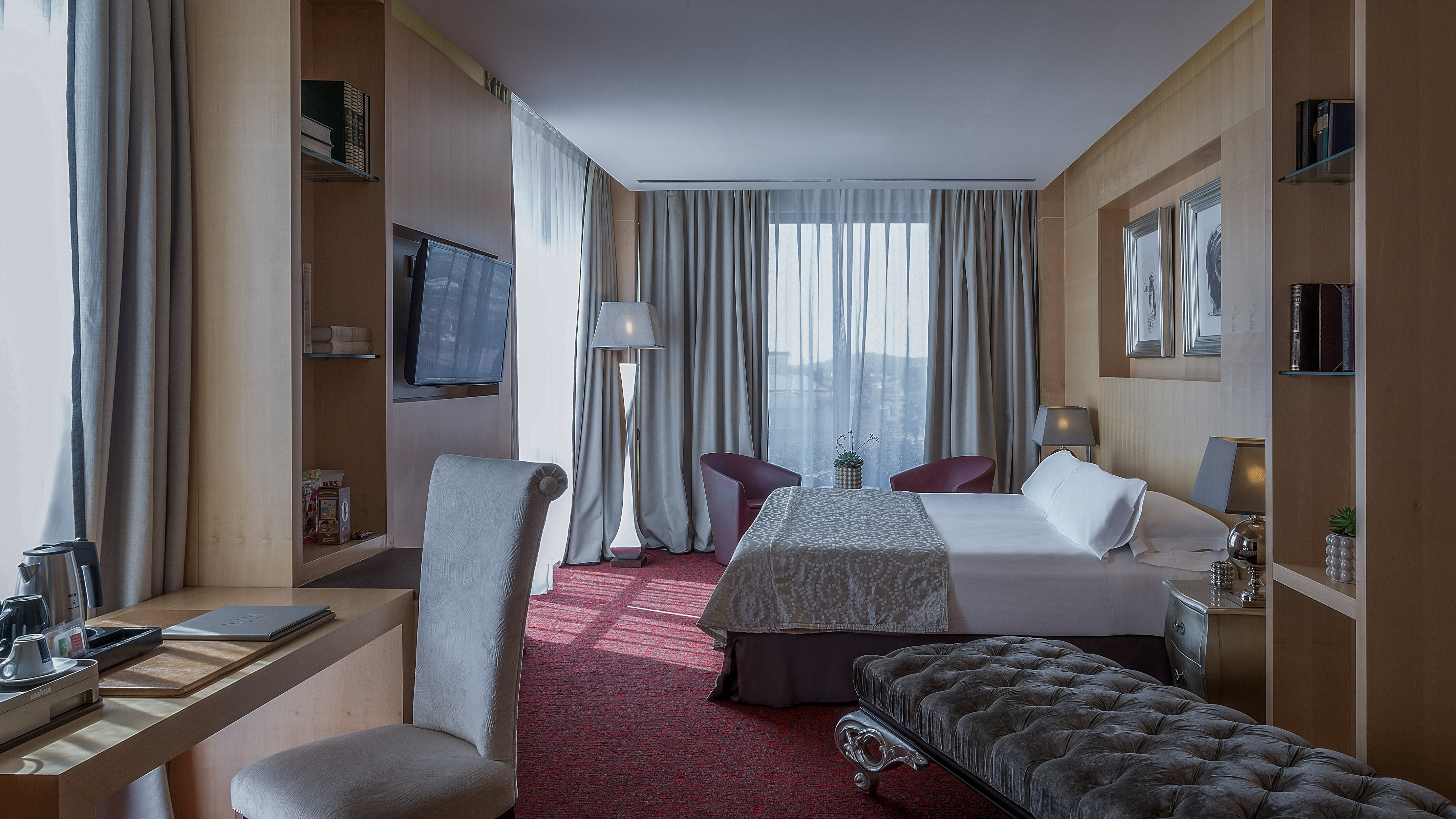 a room with a bed and a tv