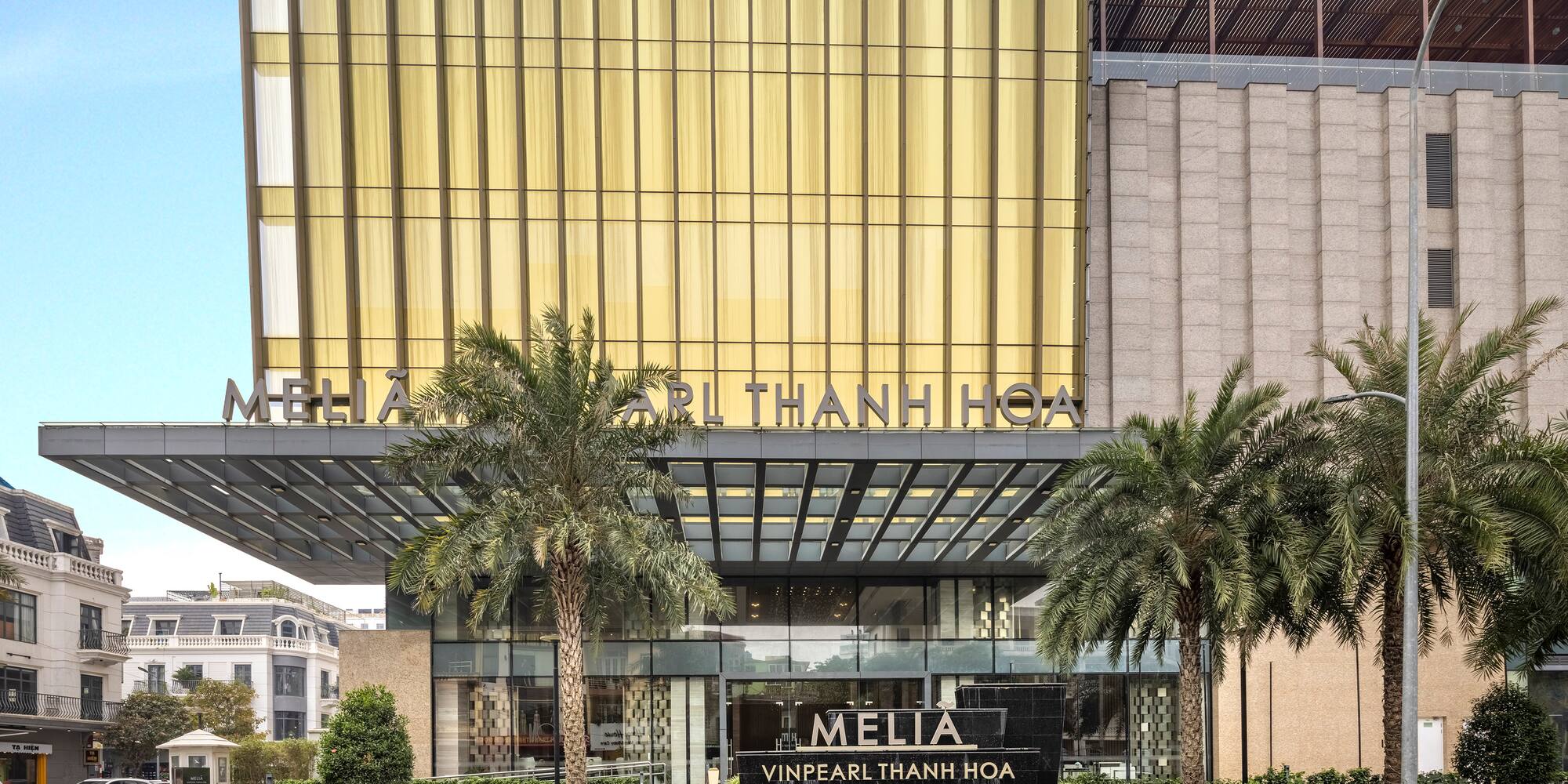 a building with palm trees