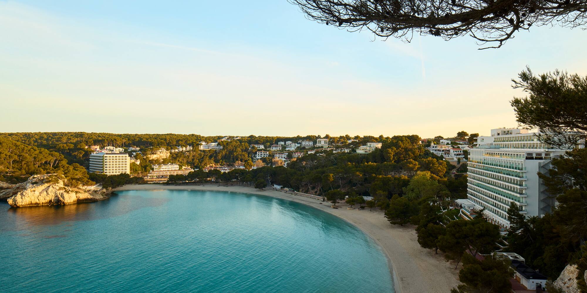 a body of water with buildings and trees