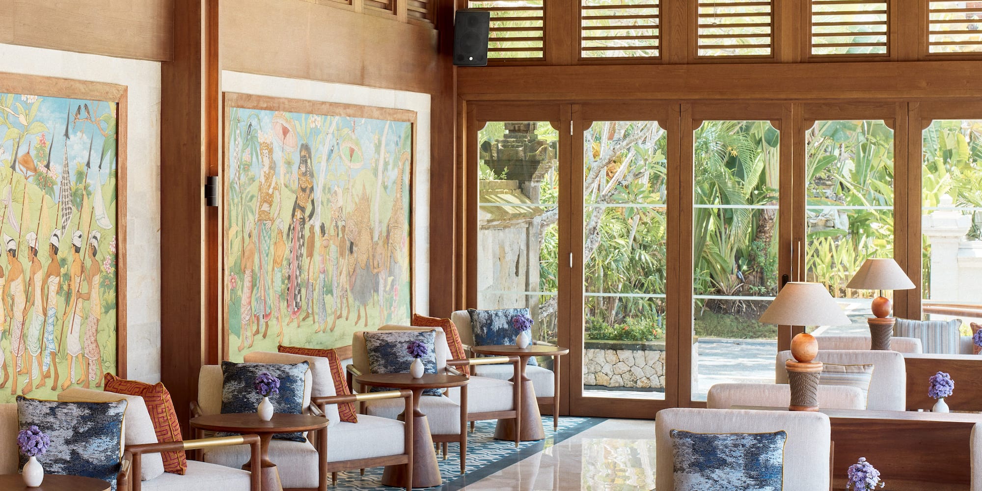 a room with a large wall and a large painting on the wall