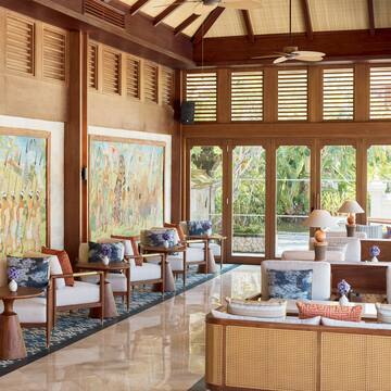 a room with a large wall and a large painting on the wall