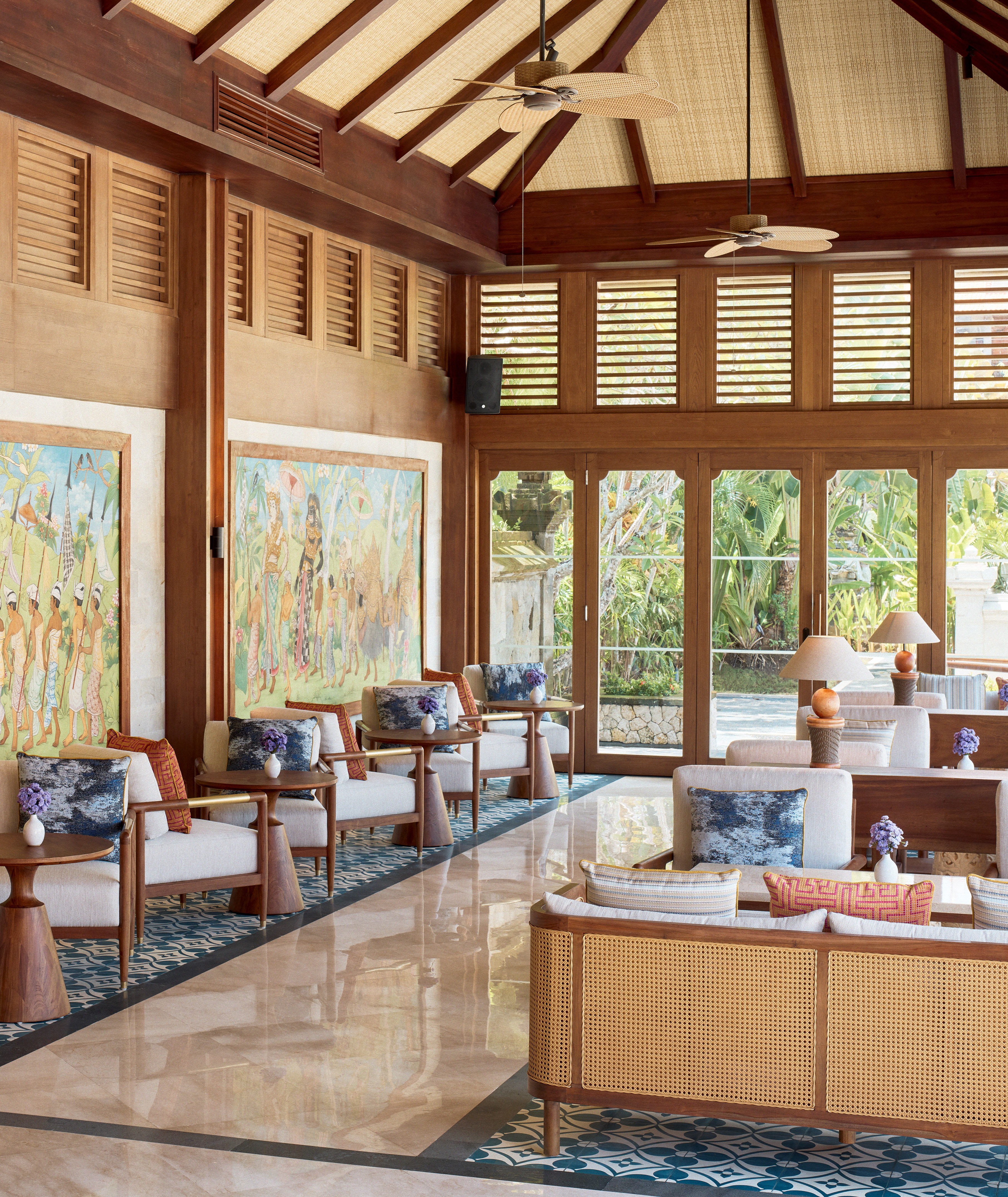 a room with a large wall and a large painting on the wall