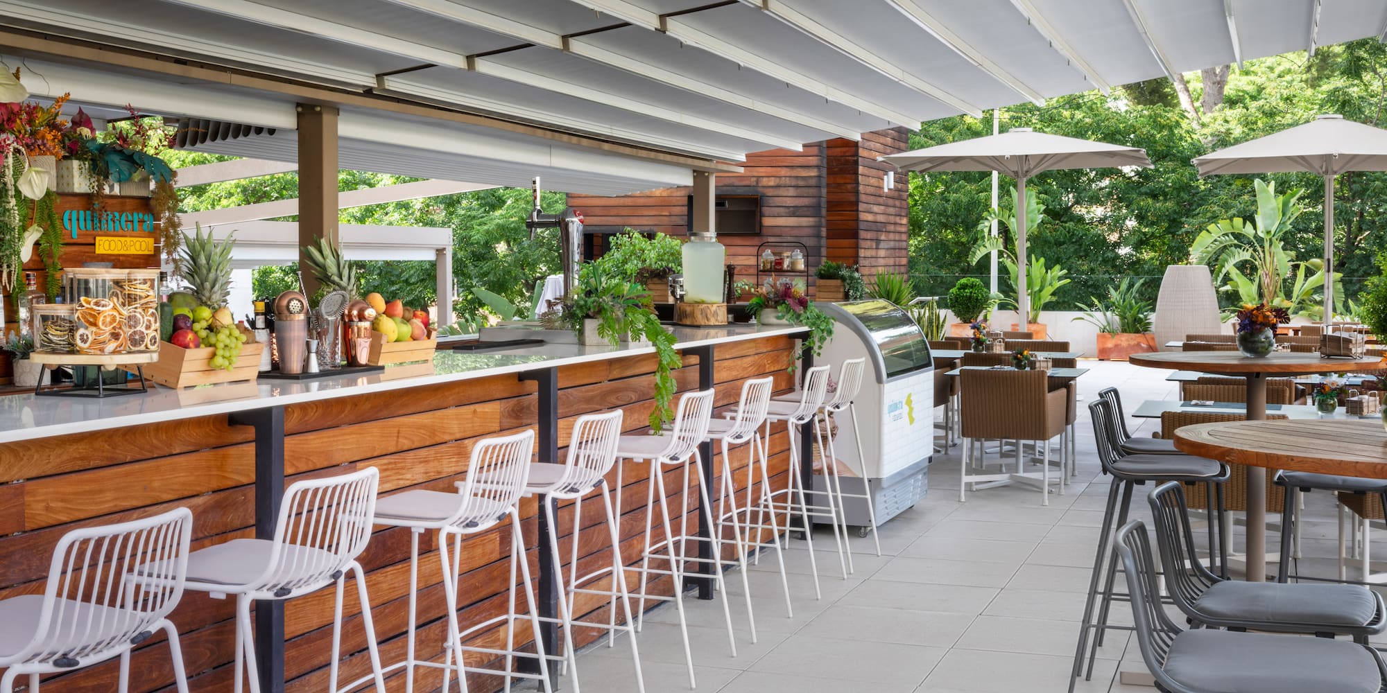 a bar with chairs and tables