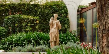 a statue in a garden