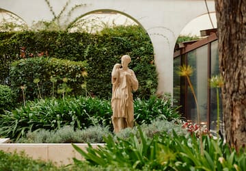 a statue in a garden