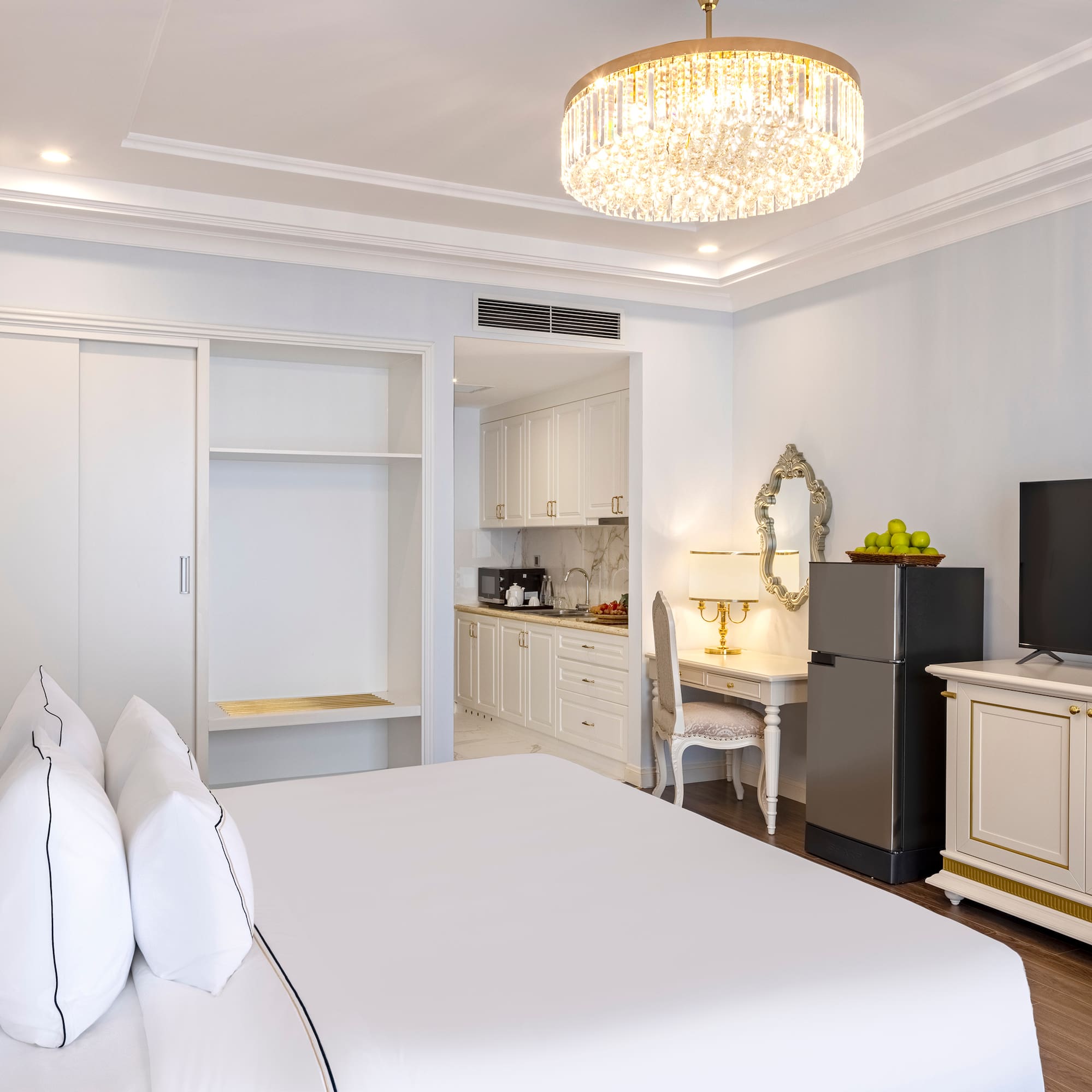 a room with a bed and a refrigerator