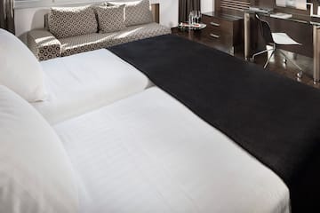 a bed with a black blanket on it