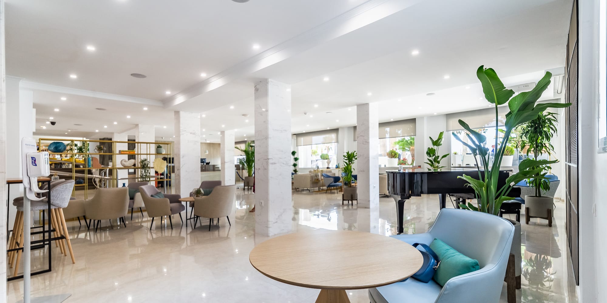 a room with a piano and chairs