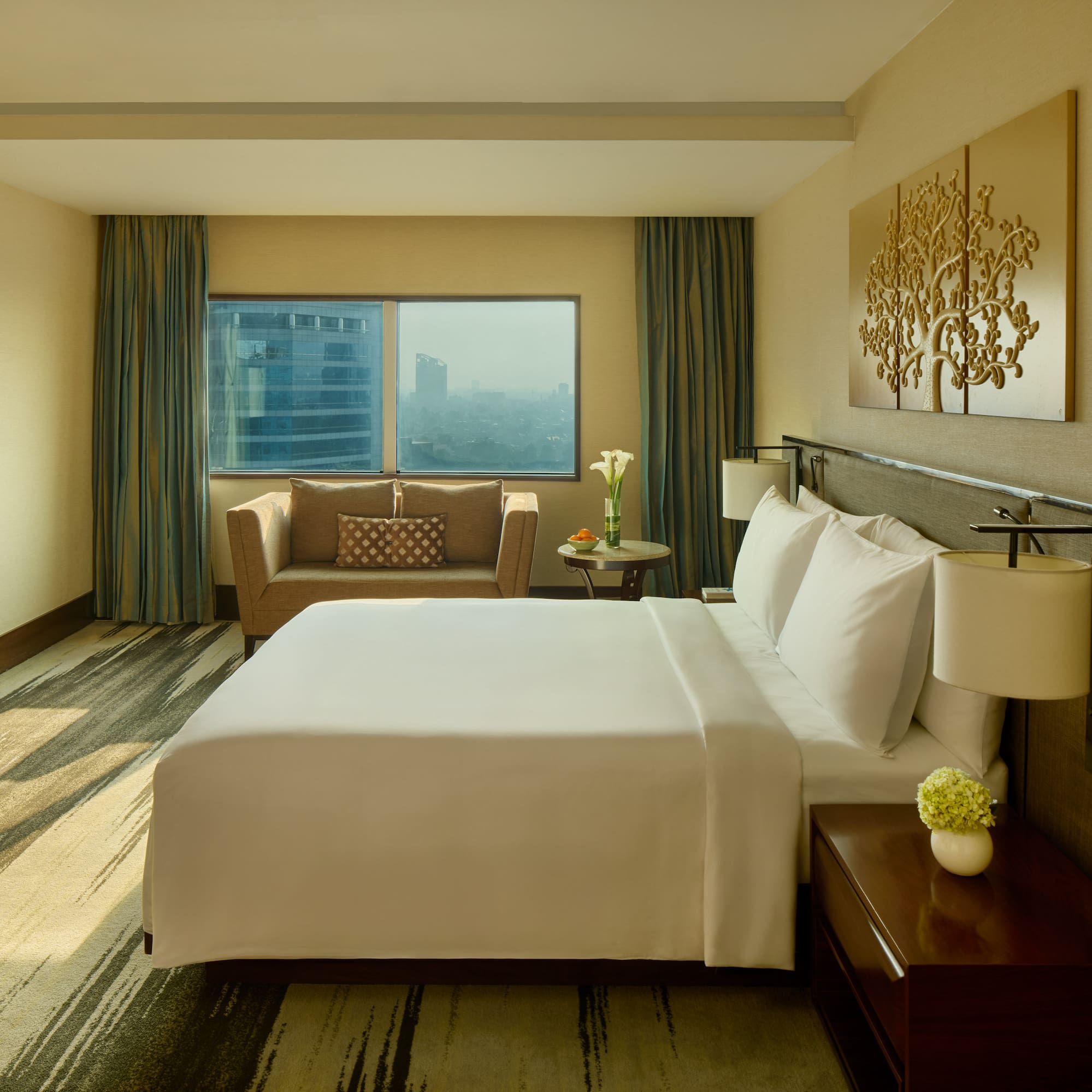 a hotel room with a bed and a chair