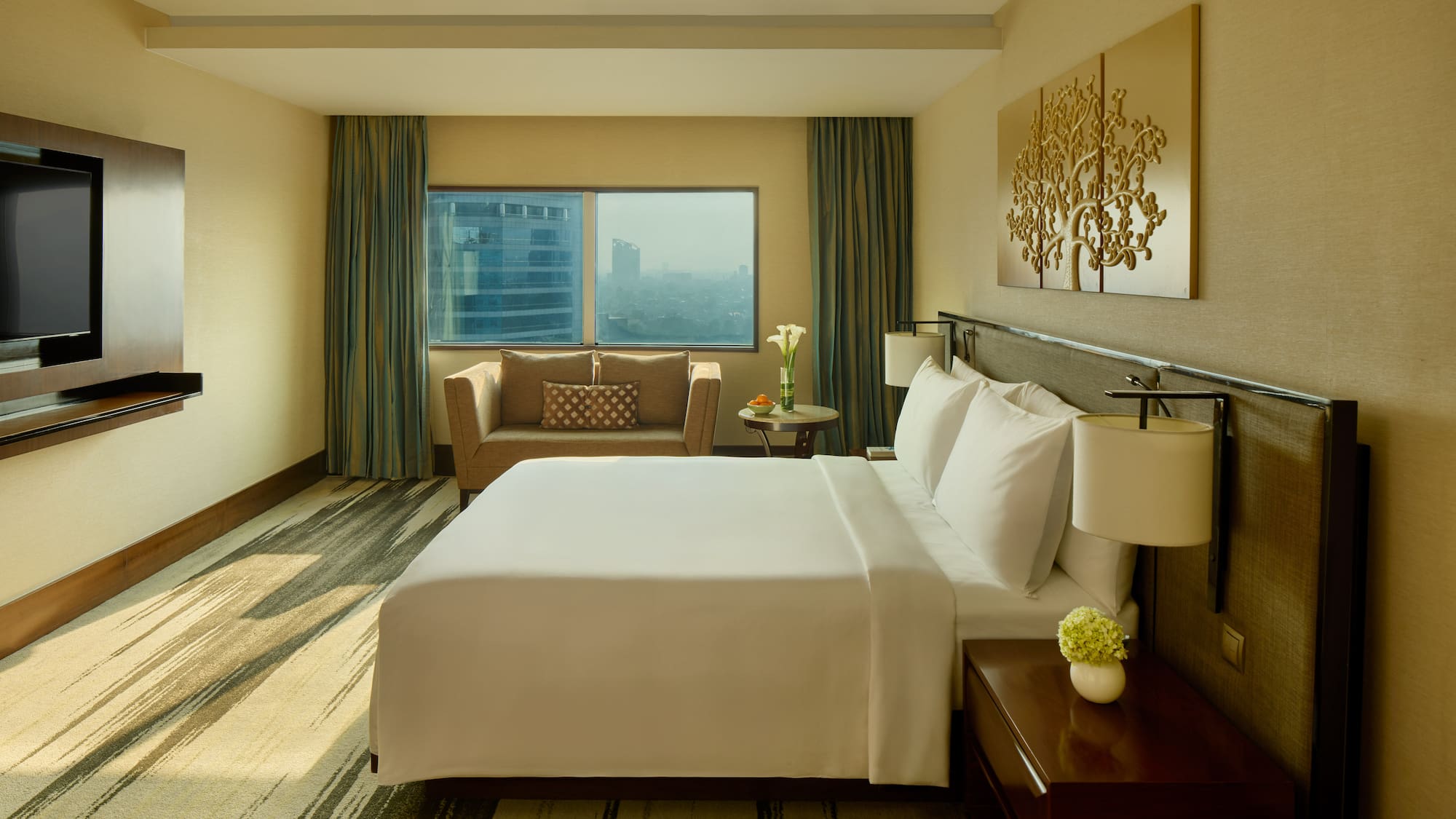 a hotel room with a bed and a chair