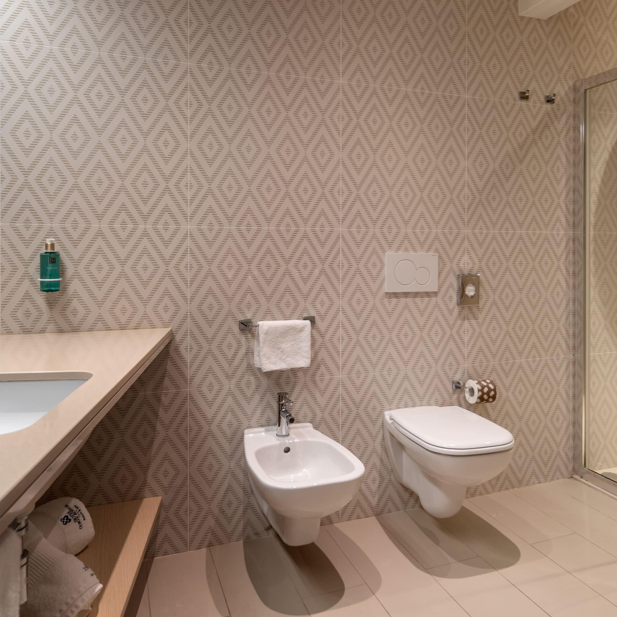 a bathroom with a sink and toilet