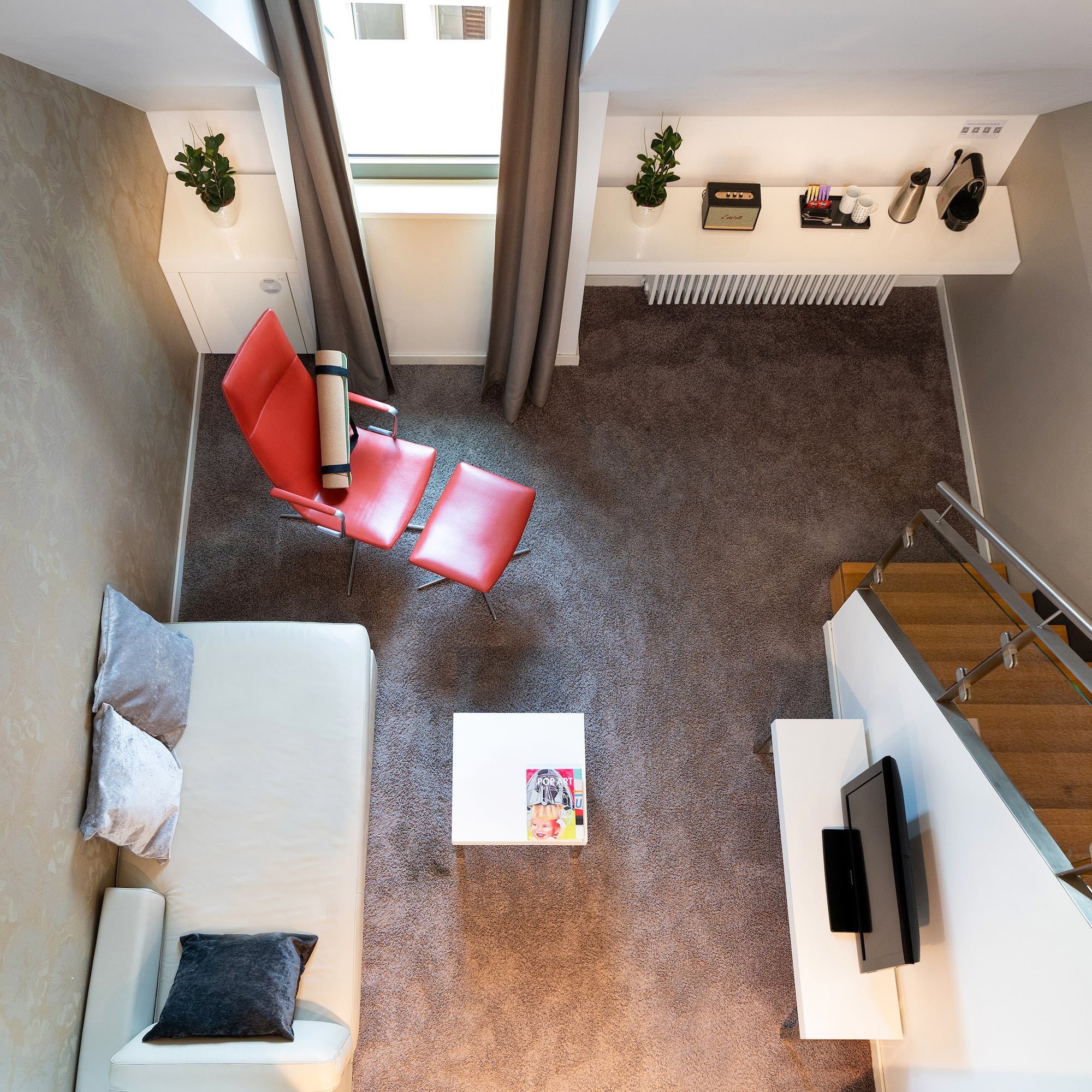 a room with a couch and a tv