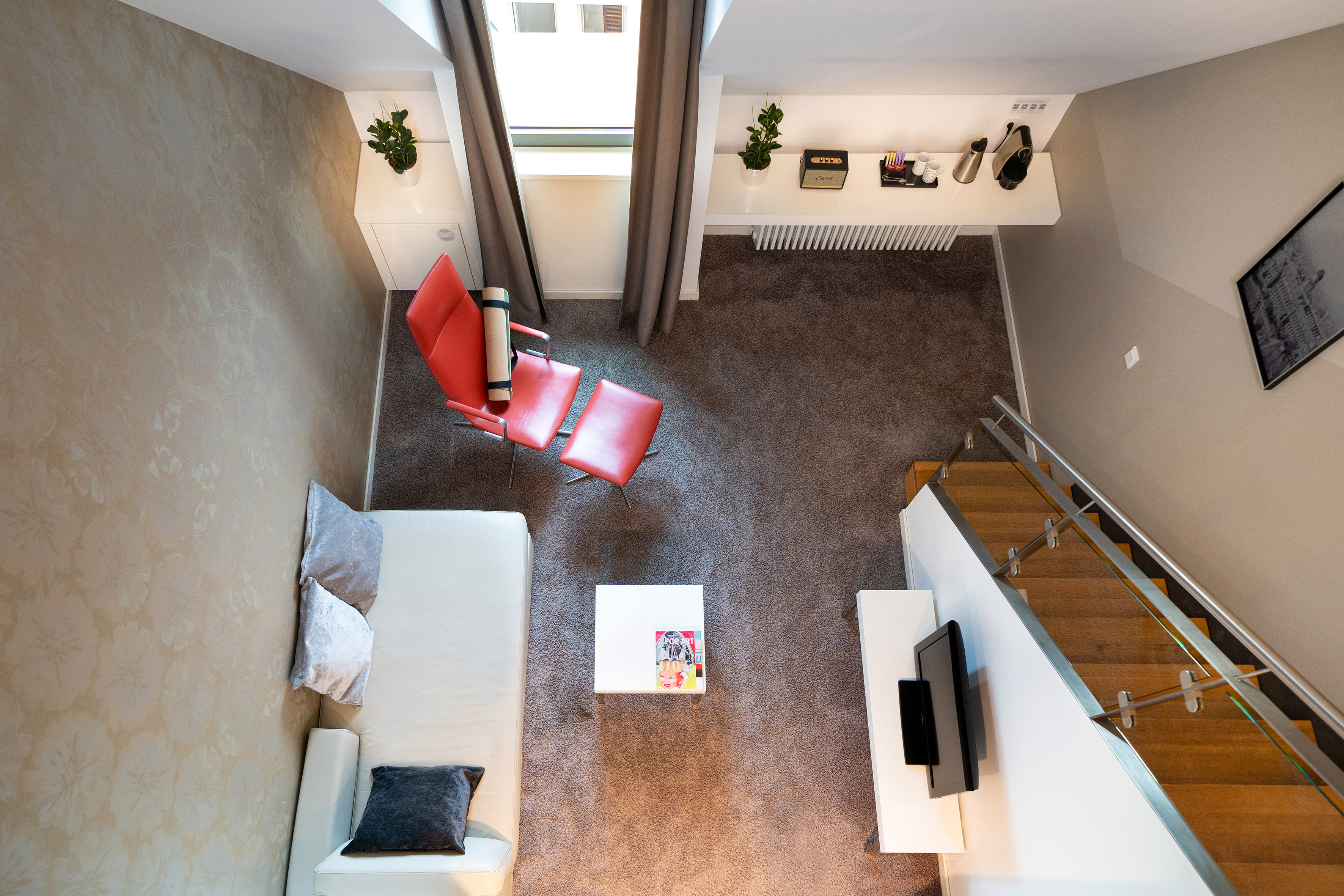 a room with a couch and a tv