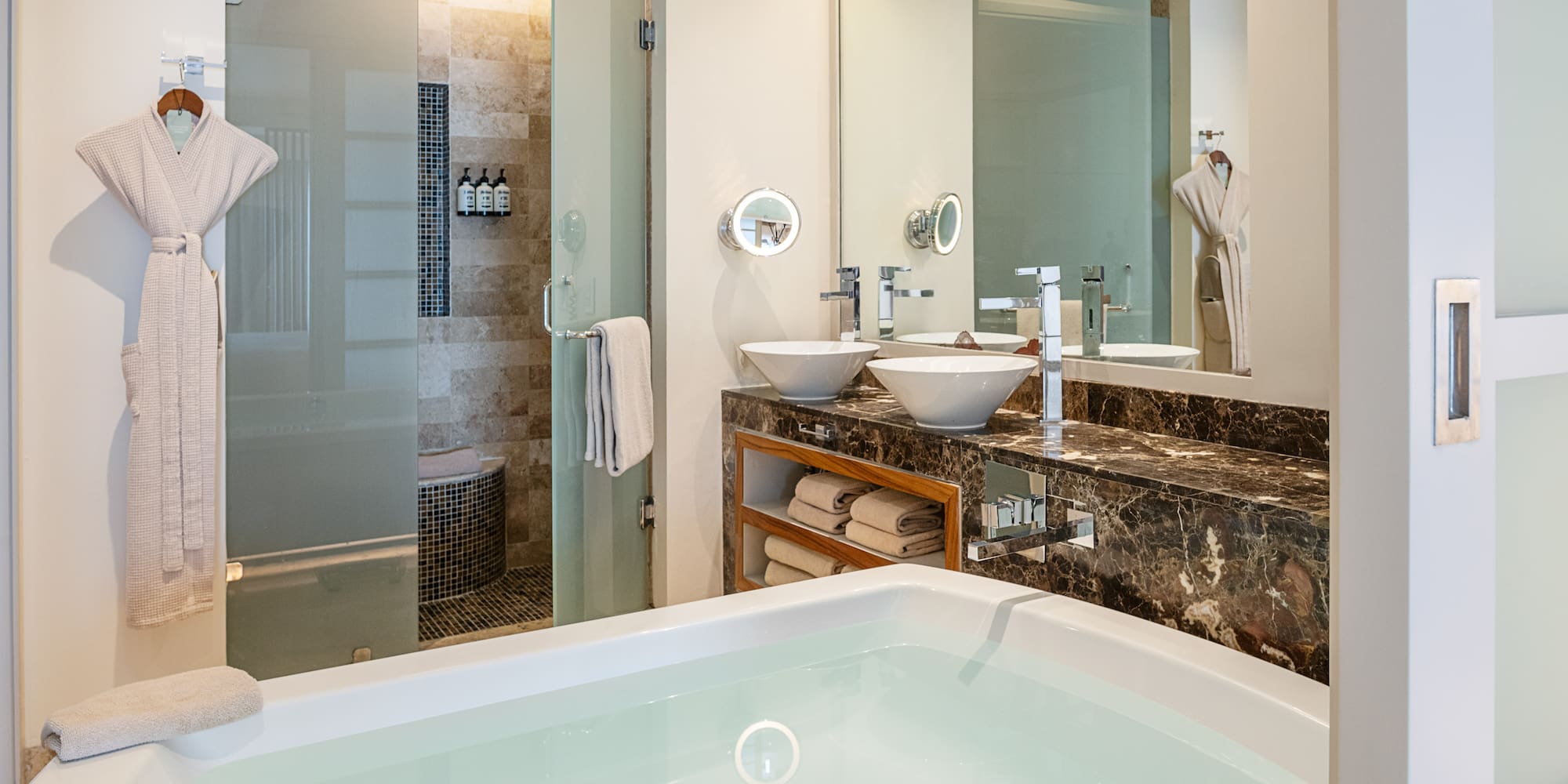 a bathroom with a bathtub and a shower