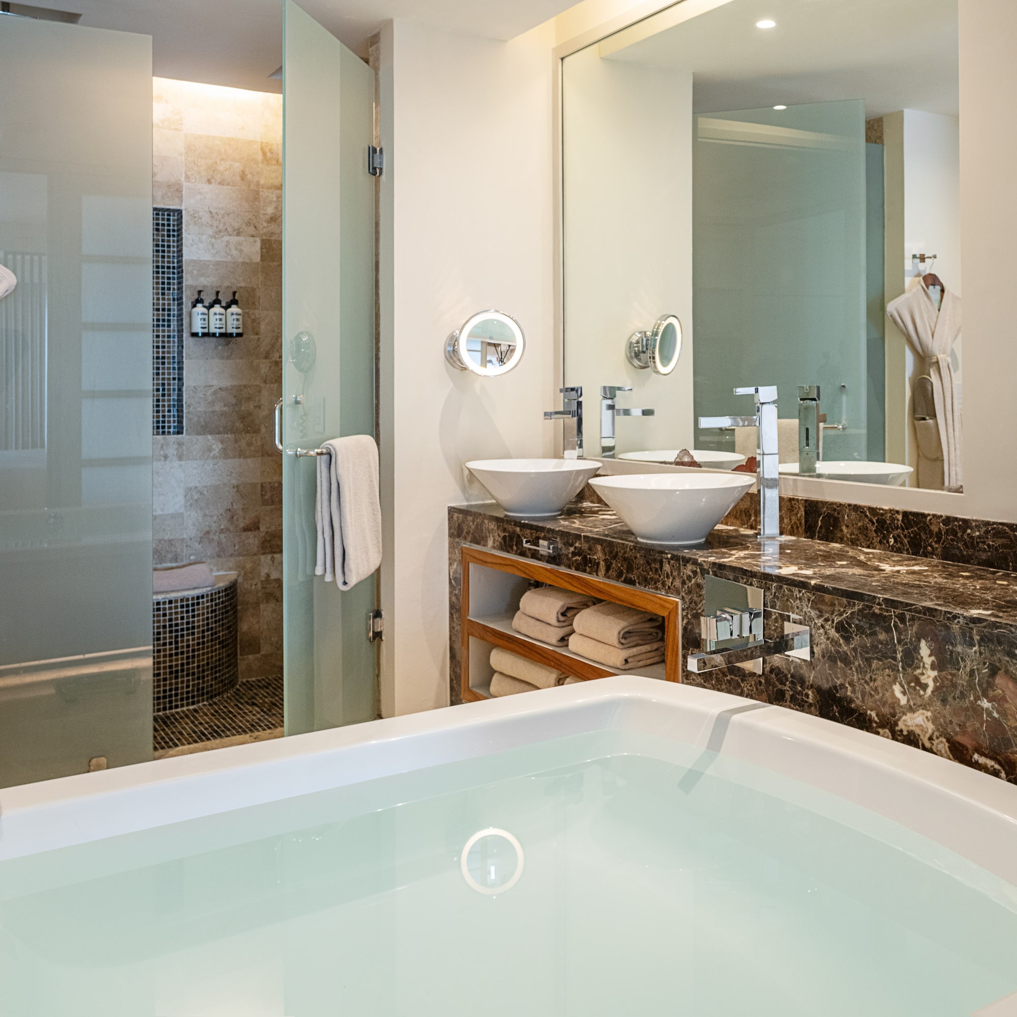 a bathroom with a bathtub and a shower