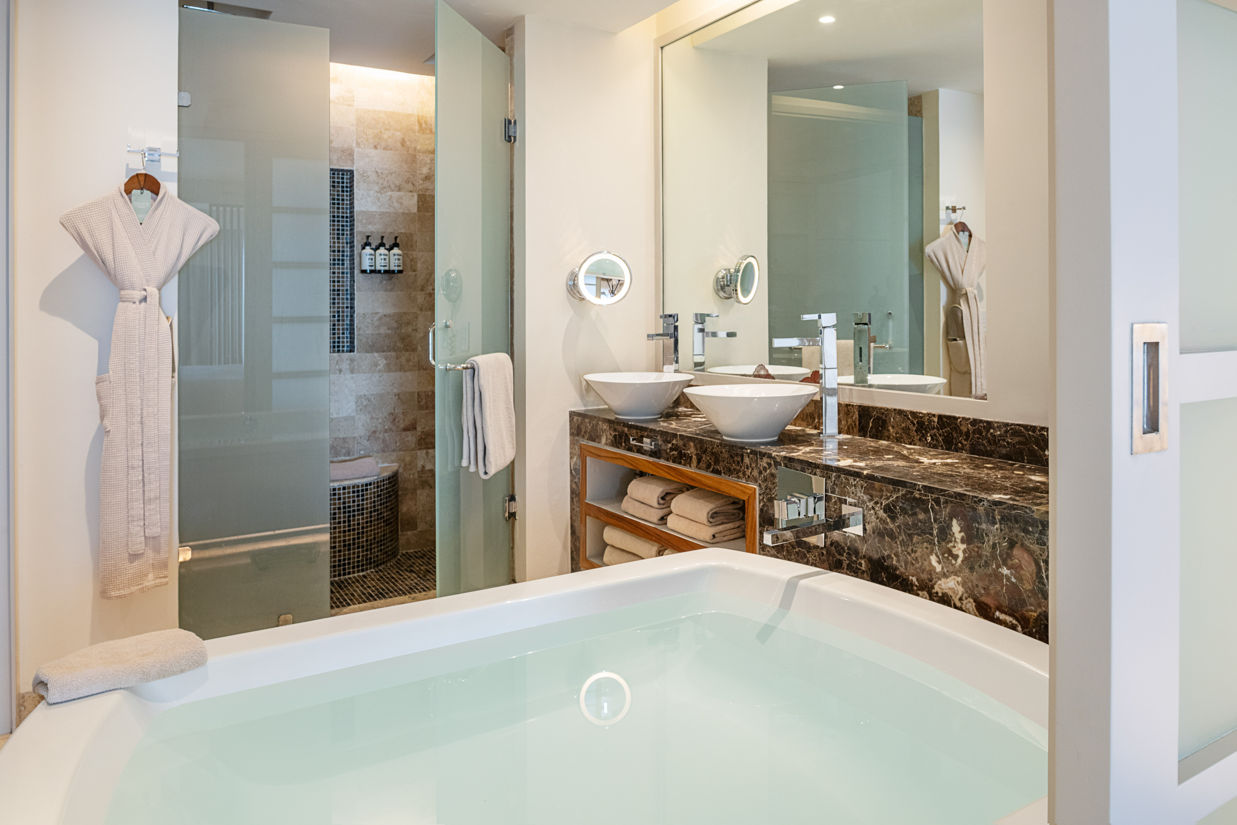 a bathroom with a bathtub and a shower