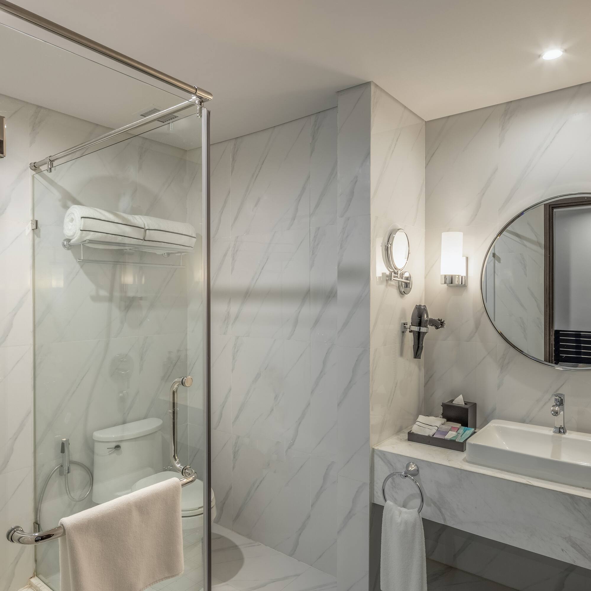 a bathroom with a mirror and a shower