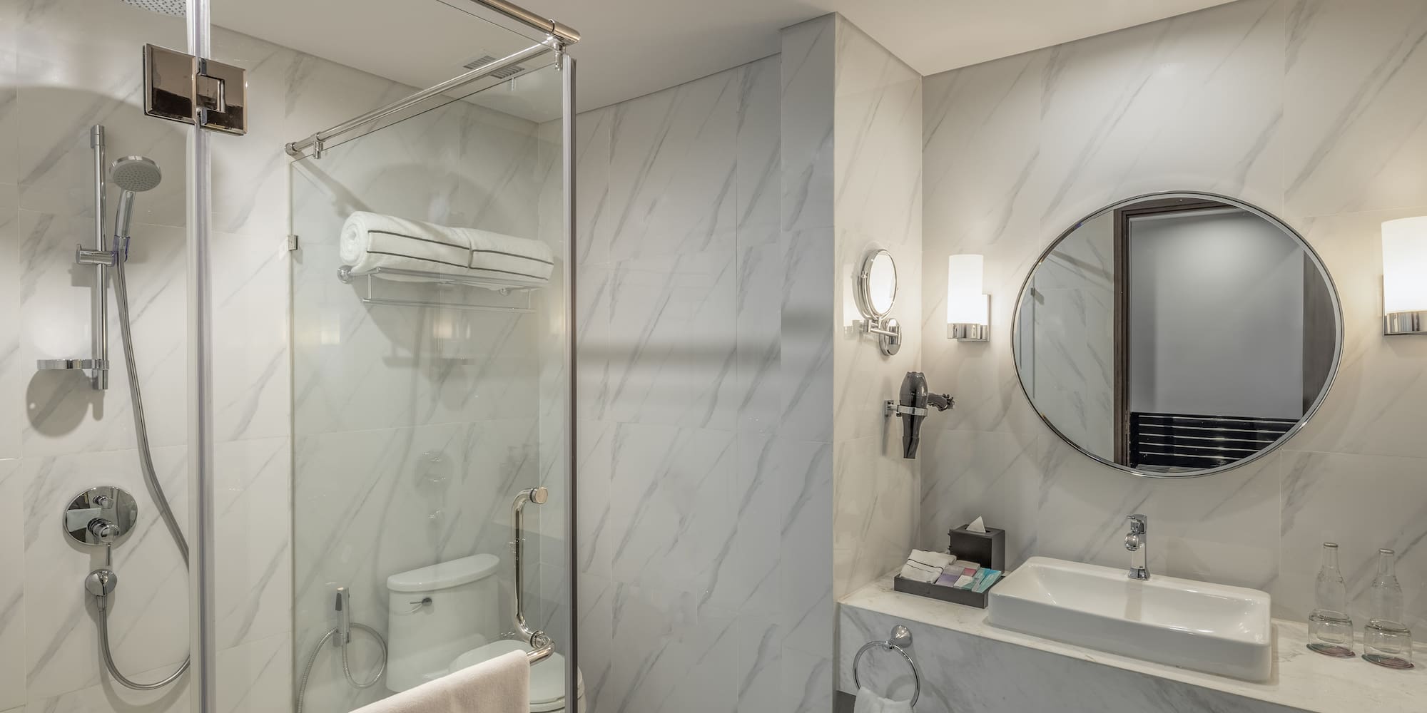 a bathroom with a mirror and a shower