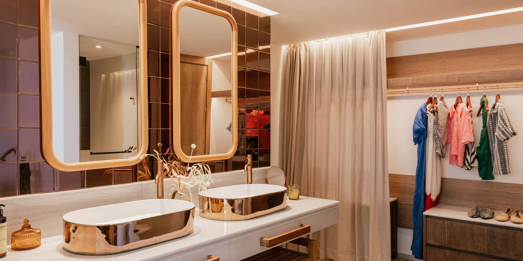 a bathroom with two sinks and a shower curtain
