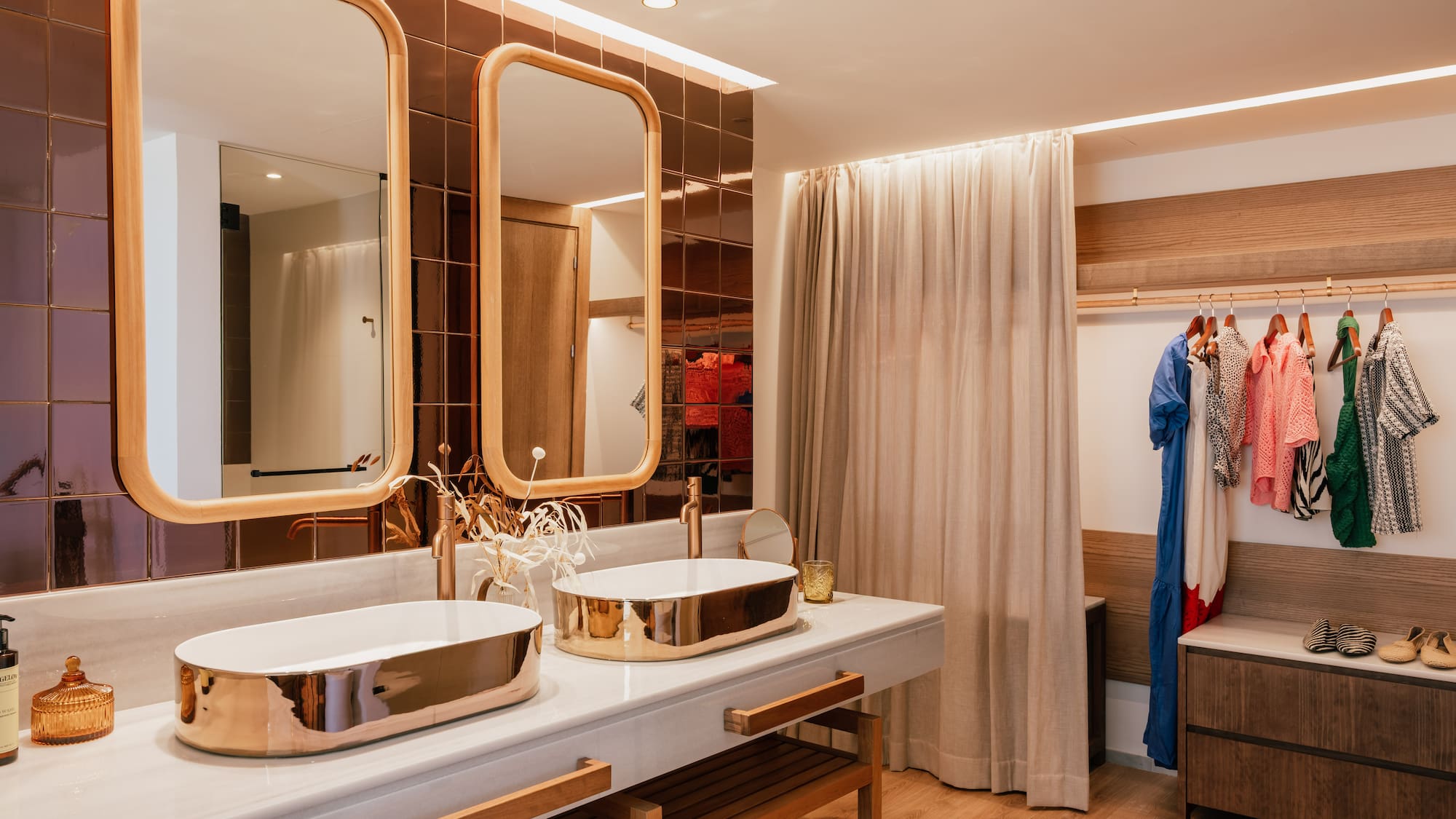 a bathroom with two sinks and a shower curtain