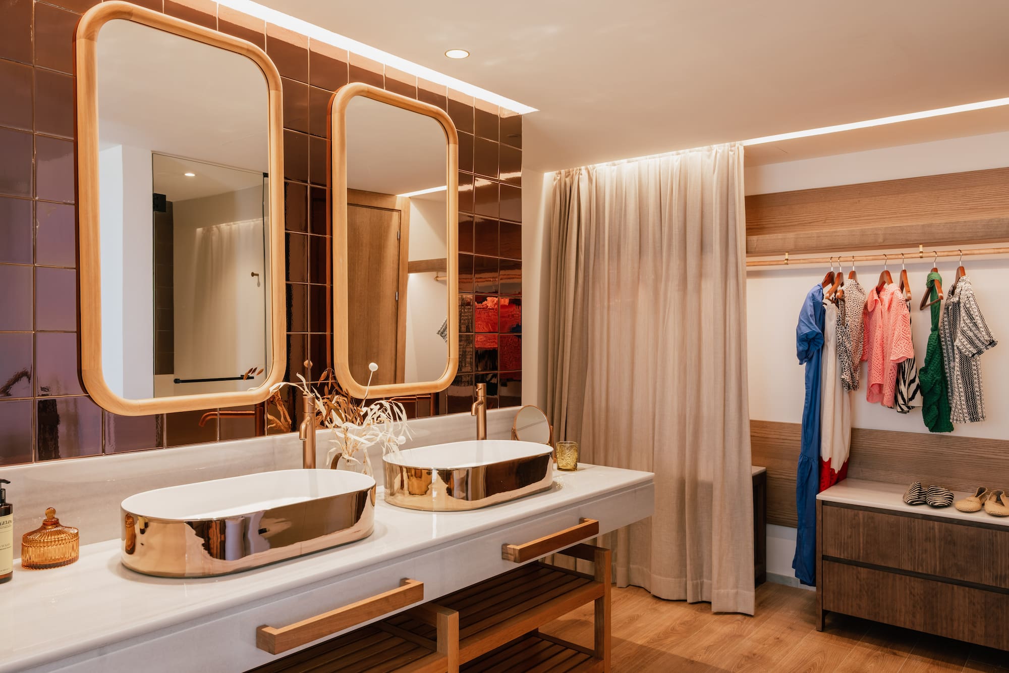 a bathroom with two sinks and a shower curtain