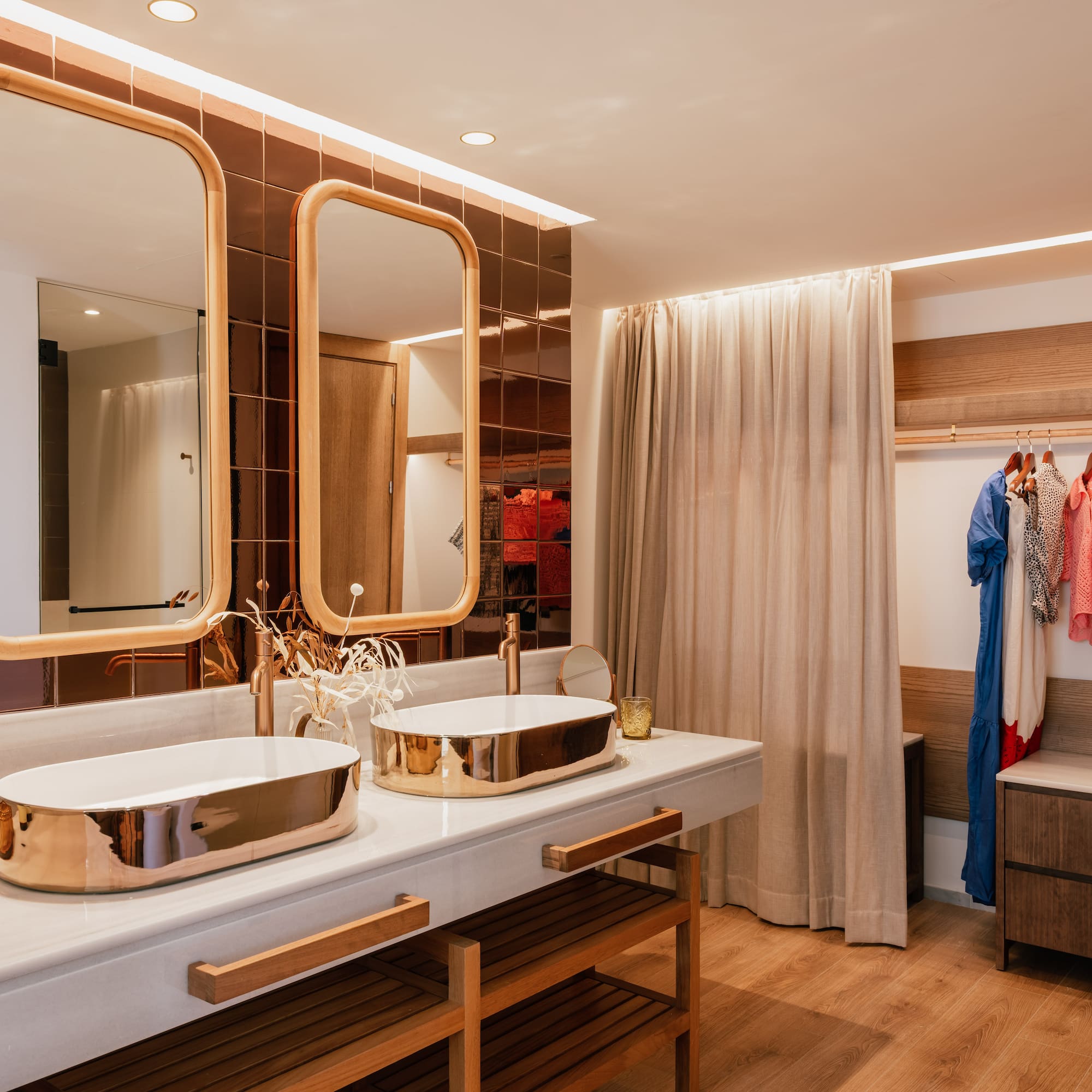 a bathroom with two sinks and a shower curtain