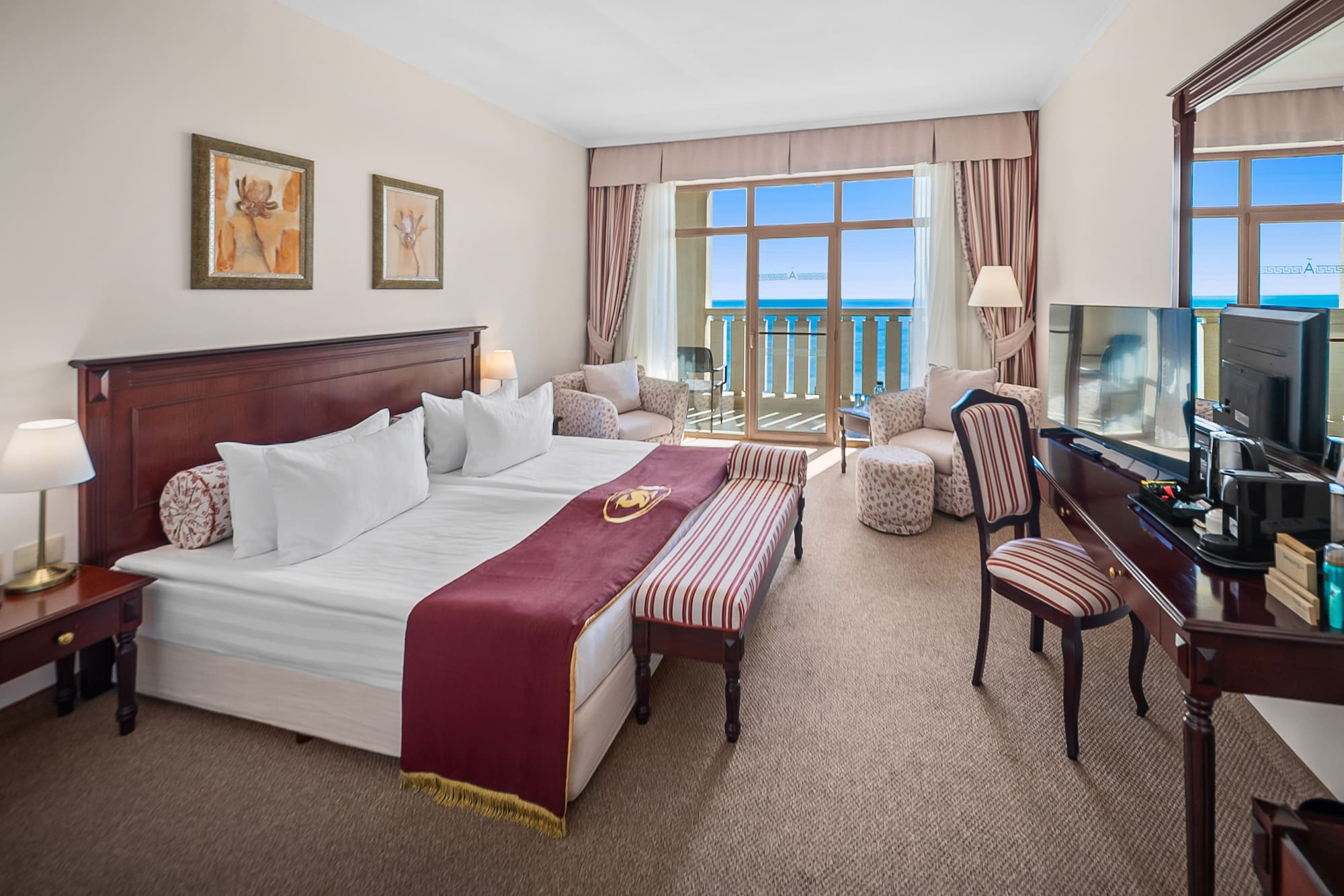 a hotel room with a piano and a bed