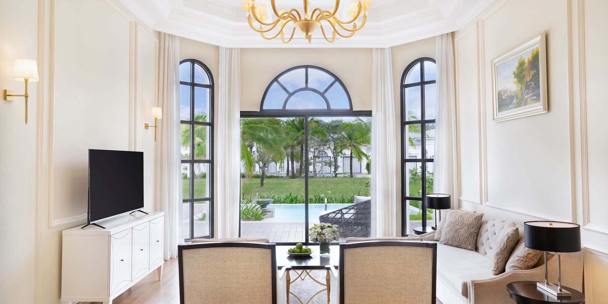 a living room with a television and a table