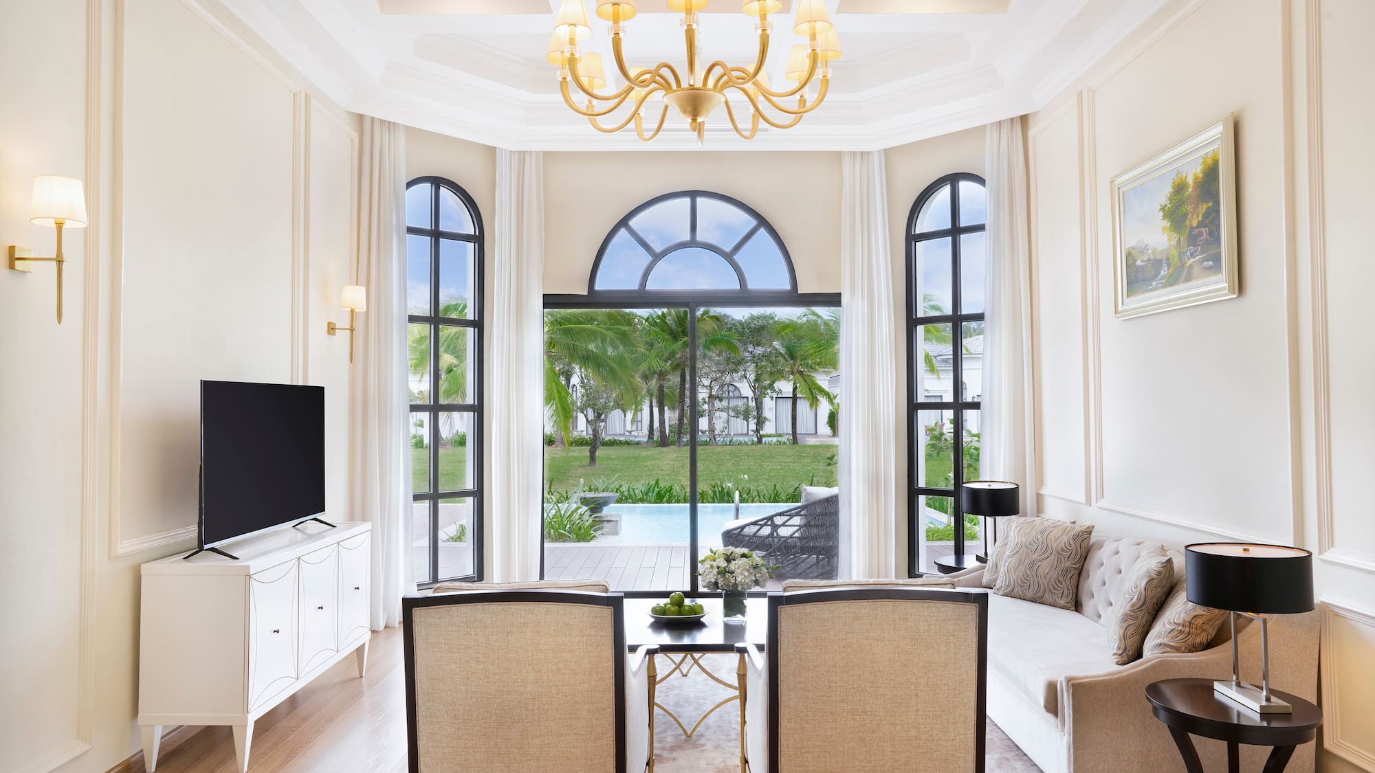 a living room with a television and a table