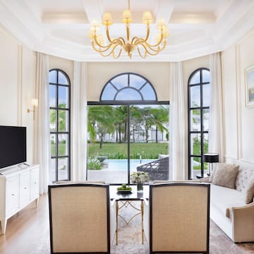 a living room with a television and a table