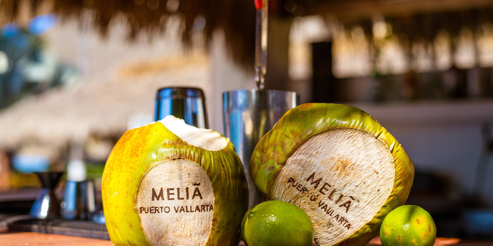 a coconuts and limes on a table