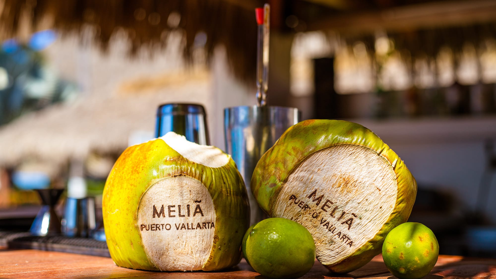 a coconuts and limes on a table