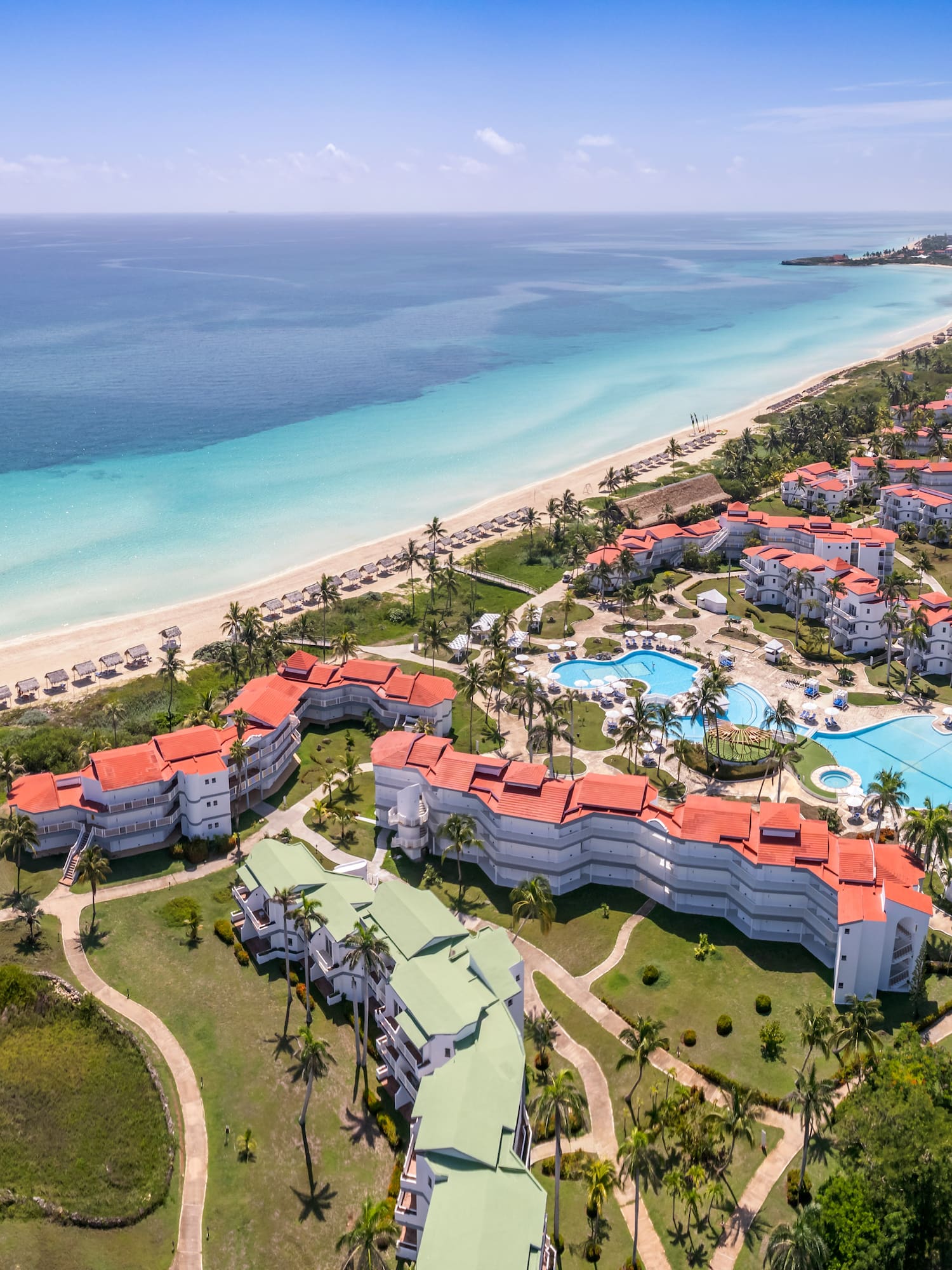 a resort with a pool and a beach