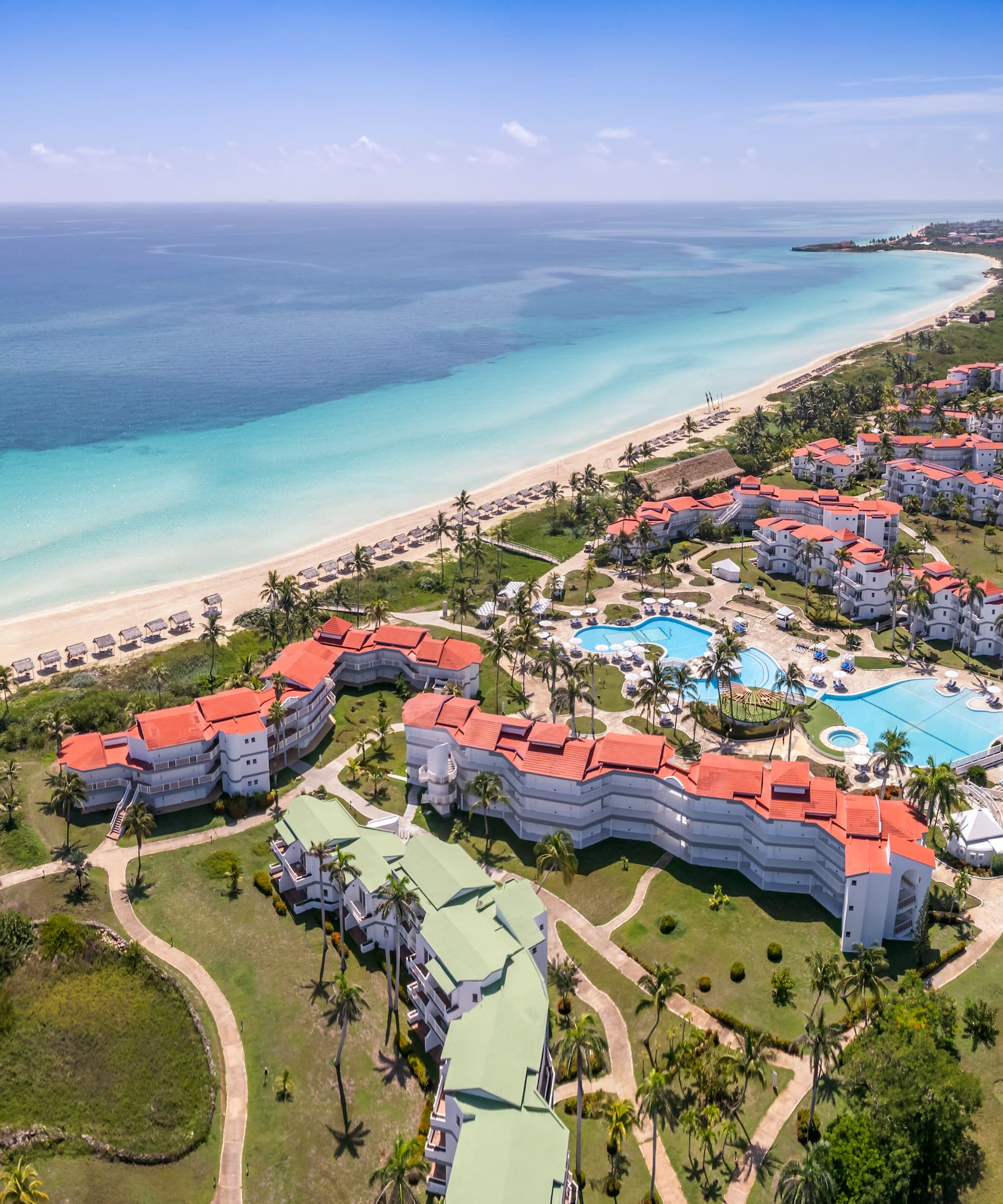 a resort with a pool and a beach