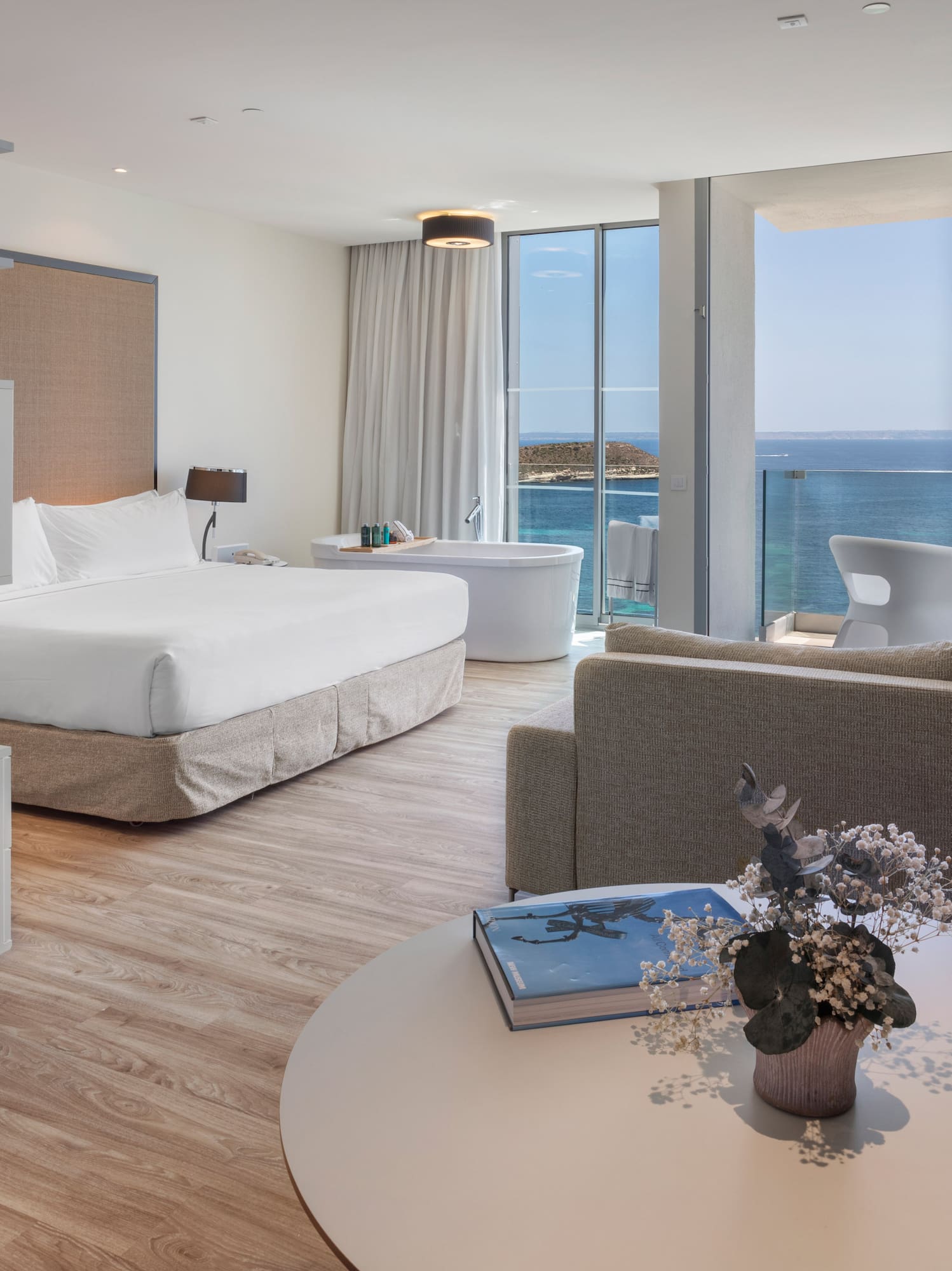 a room with a large window overlooking the ocean