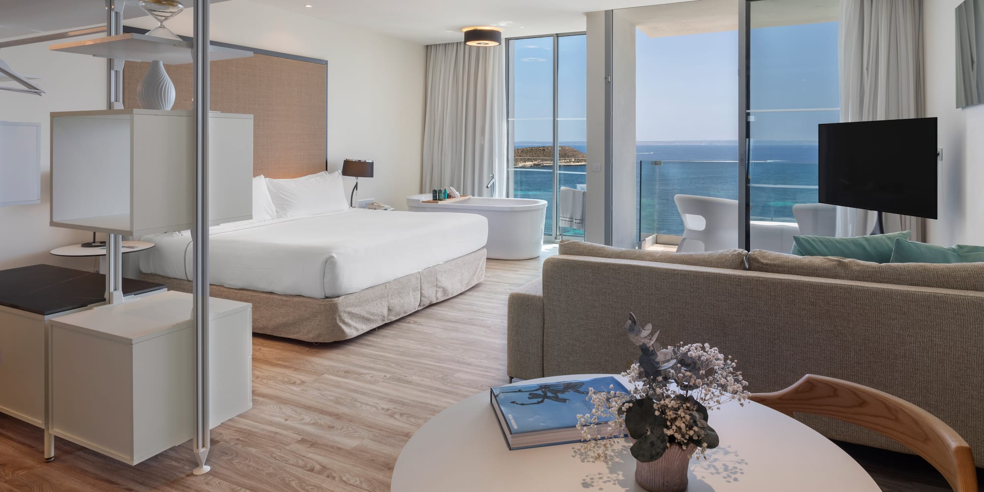 a room with a large window overlooking the ocean