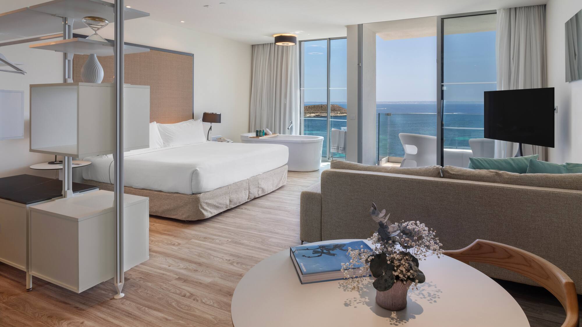 a room with a large window overlooking the ocean