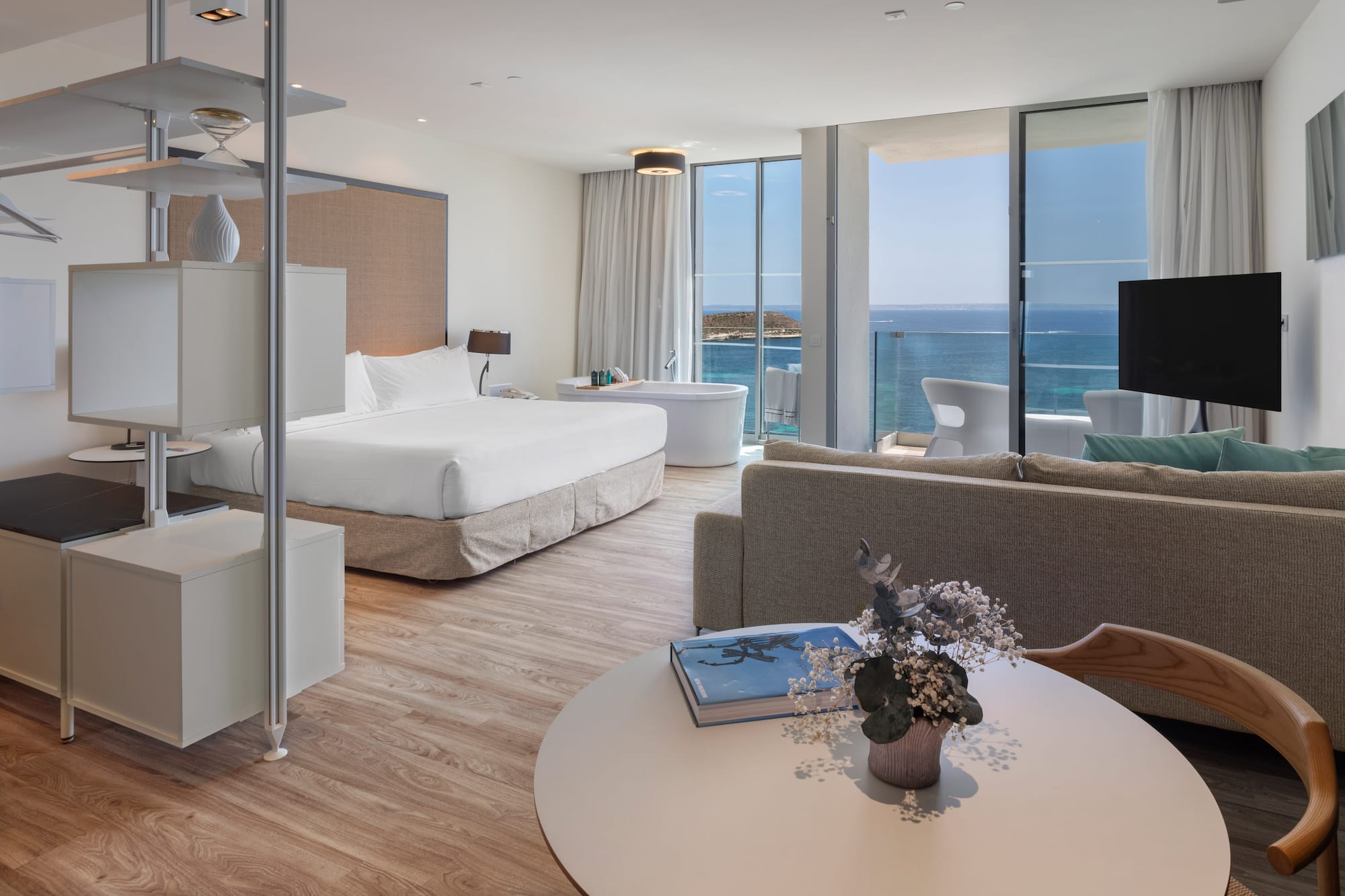 a room with a large window overlooking the ocean