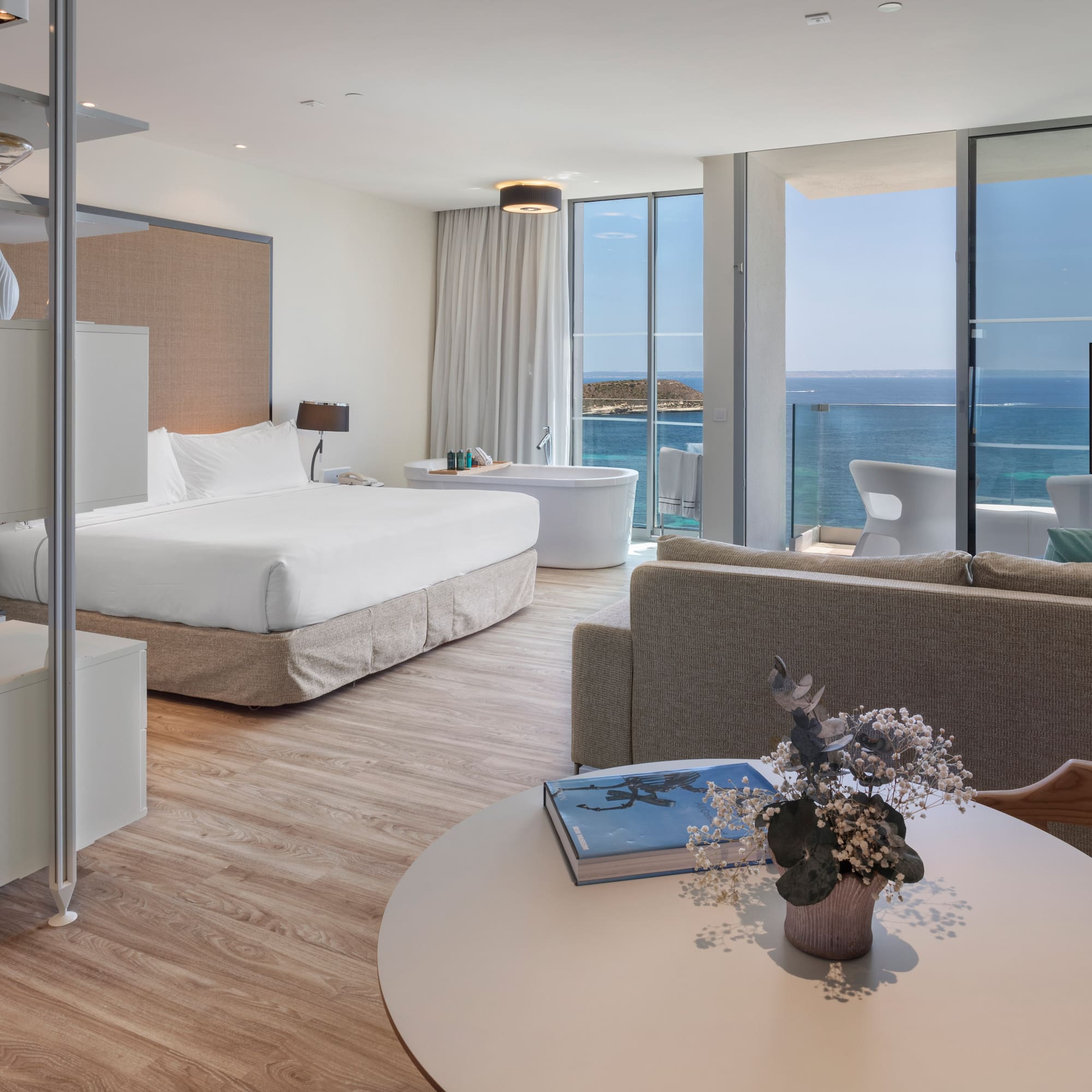 a room with a large window overlooking the ocean