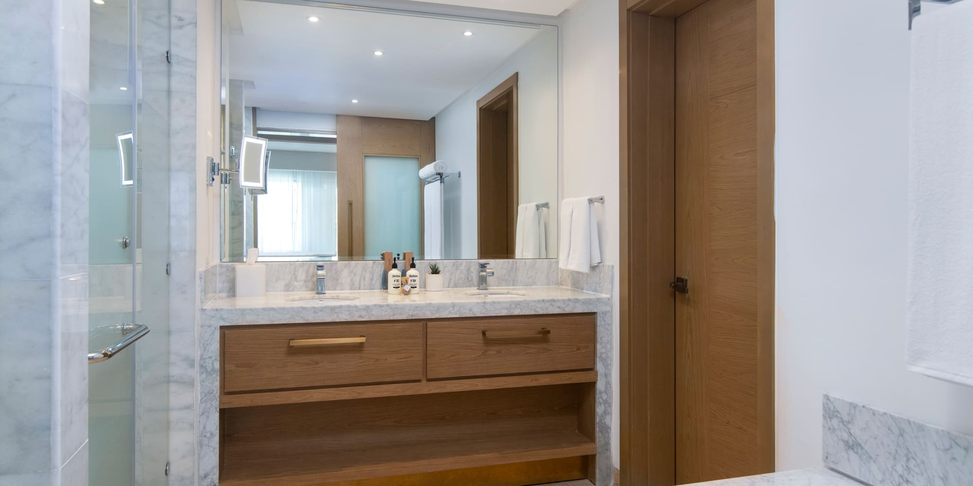 a bathroom with a marble countertop and a door