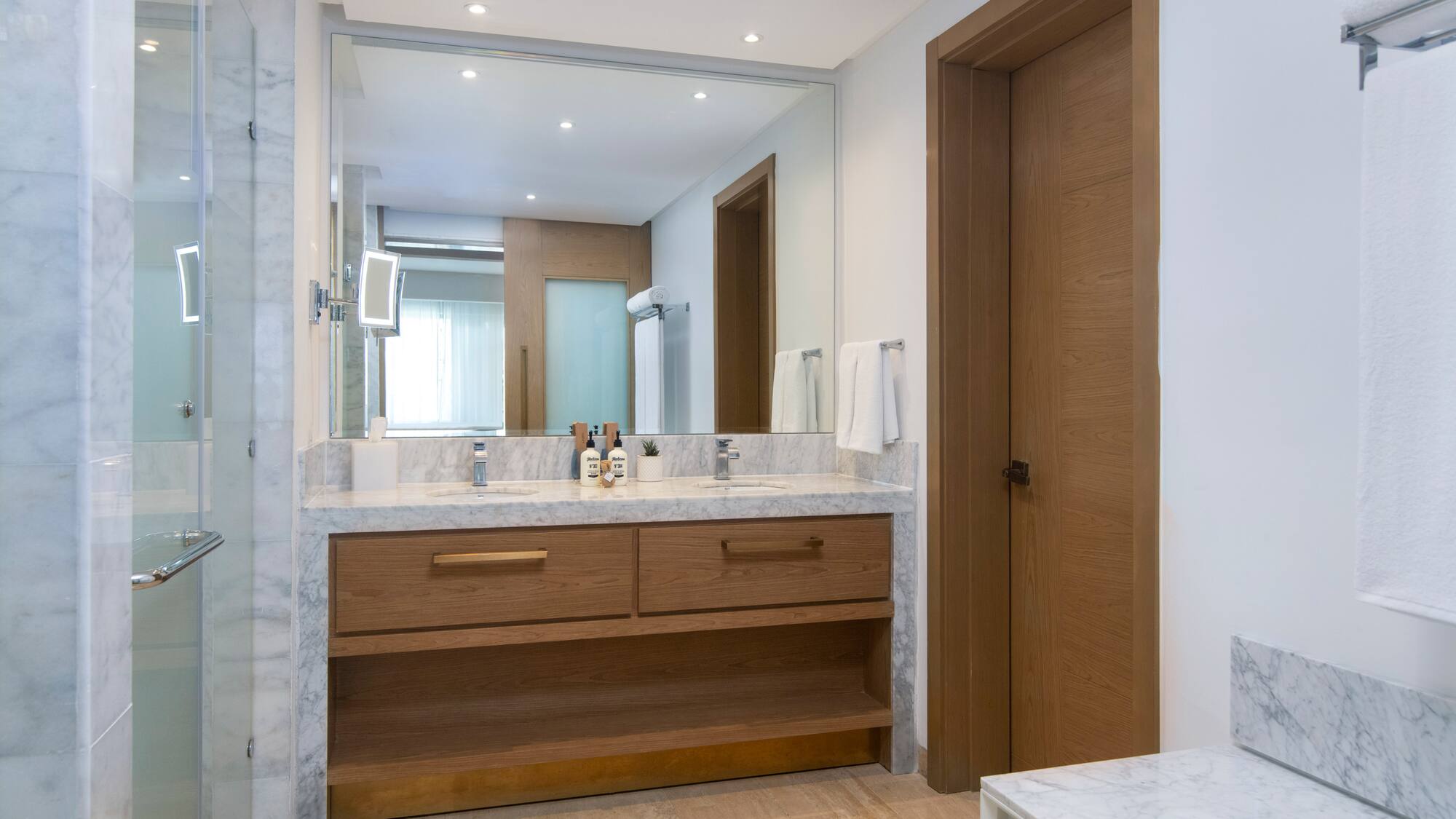 a bathroom with a marble countertop and a door